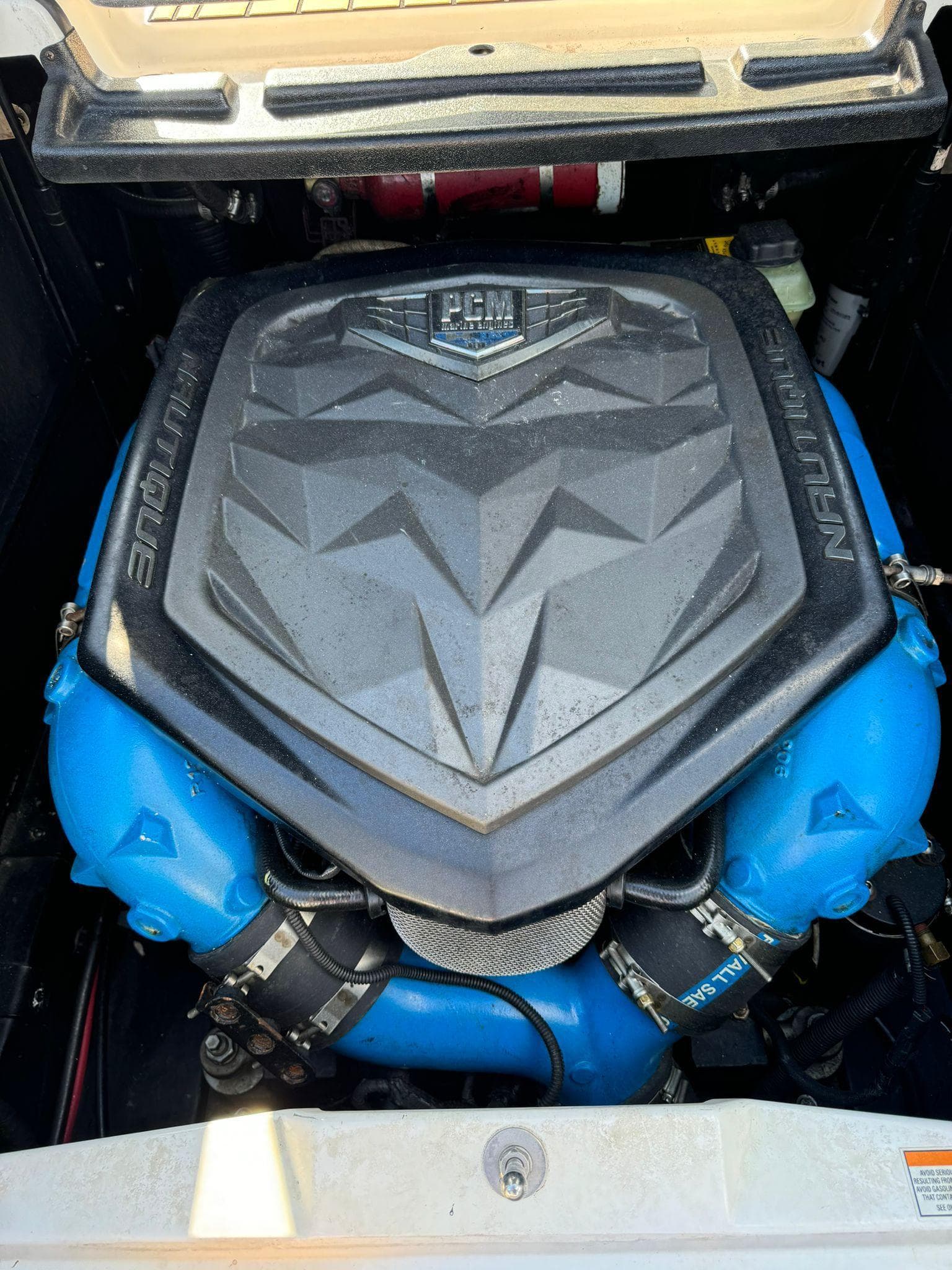 2018 Nautique Super Air Nautique G25 engine with PCM cover, showcasing powerful marine performance.