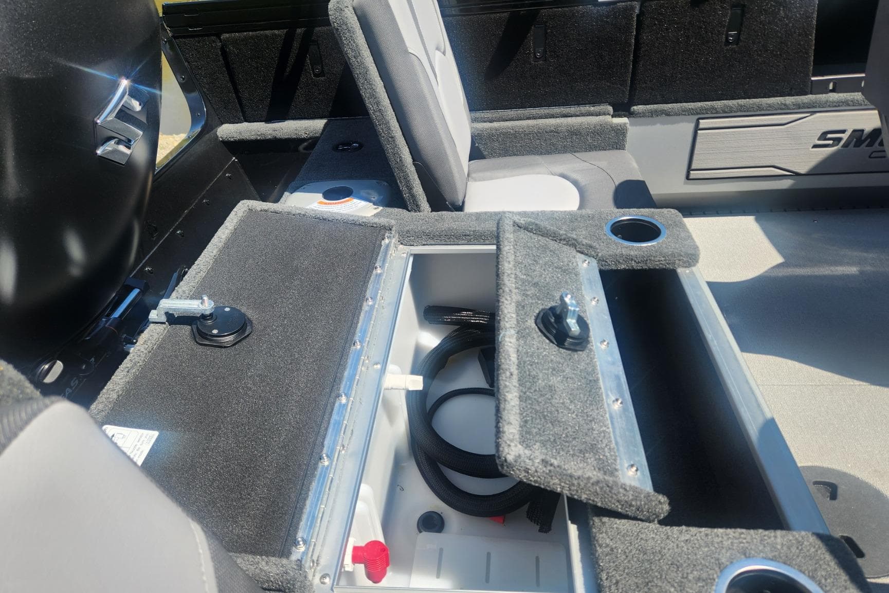 2026 Smoker Craft Adventurer 210 GLS Sport boat interior with open storage compartment.