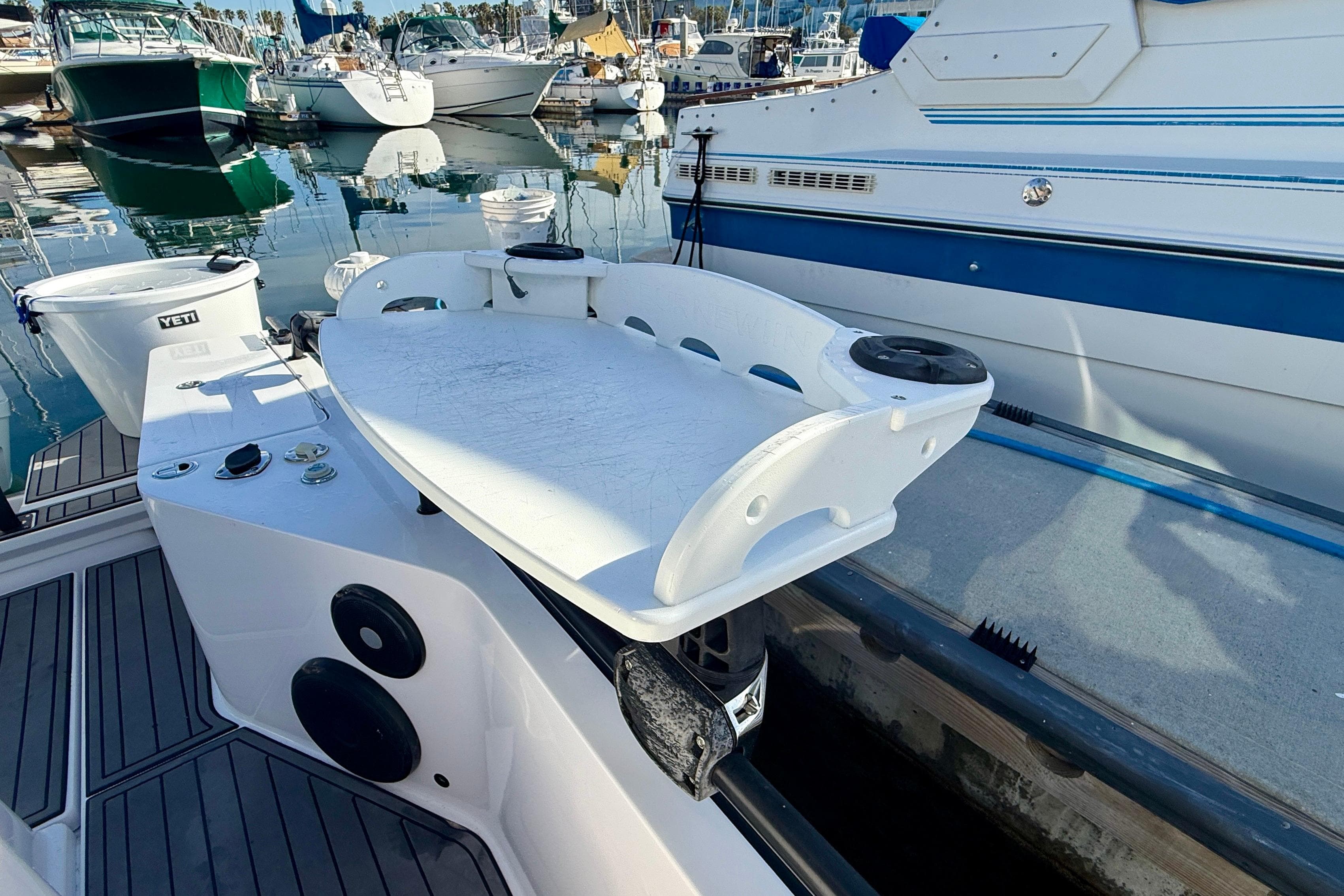 2021 Axopar Brabus 28 Cabin boat docked, featuring a sleek white deck and modern design.