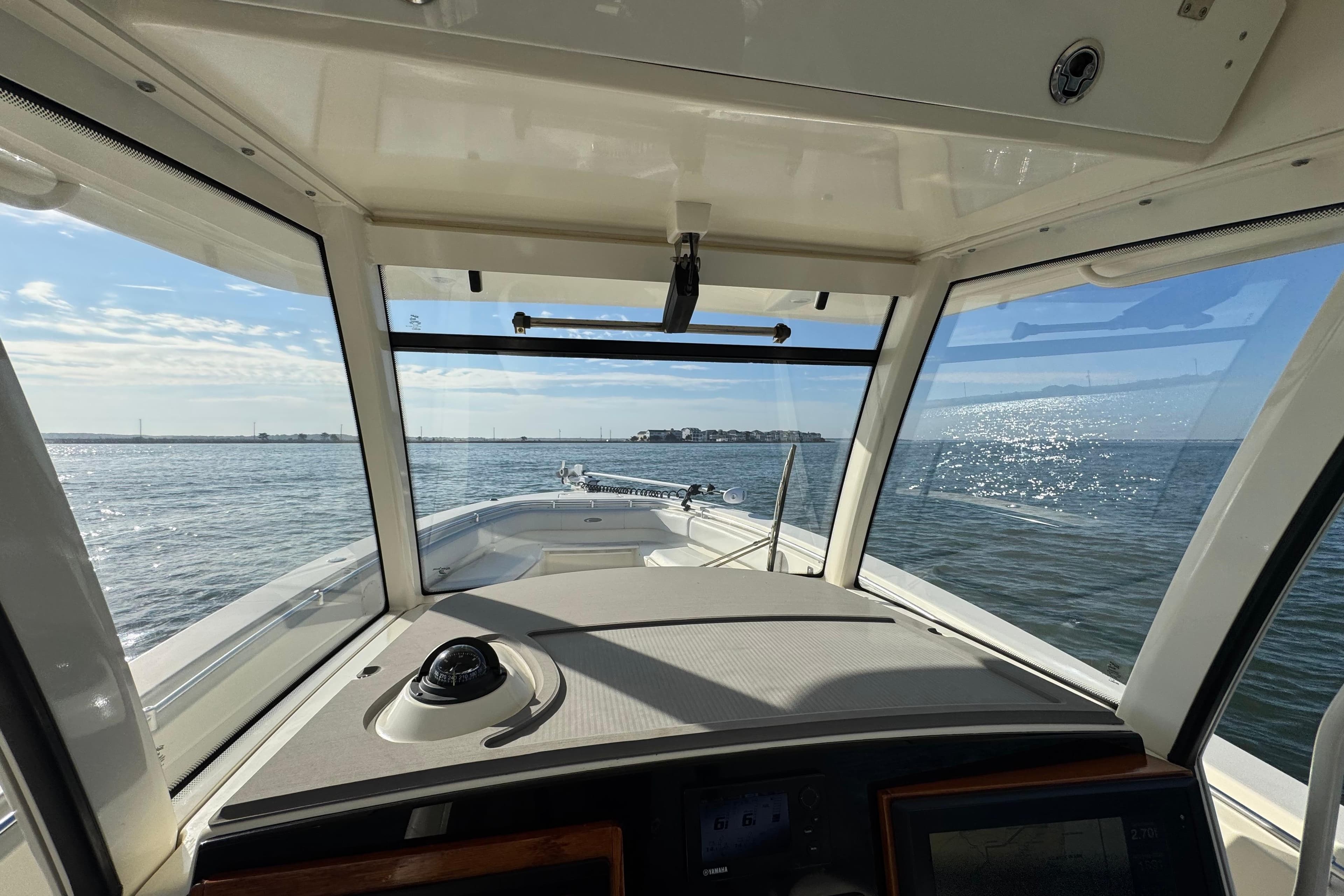 2015 Cobia 344 Center Console boat interior view with ocean horizon.