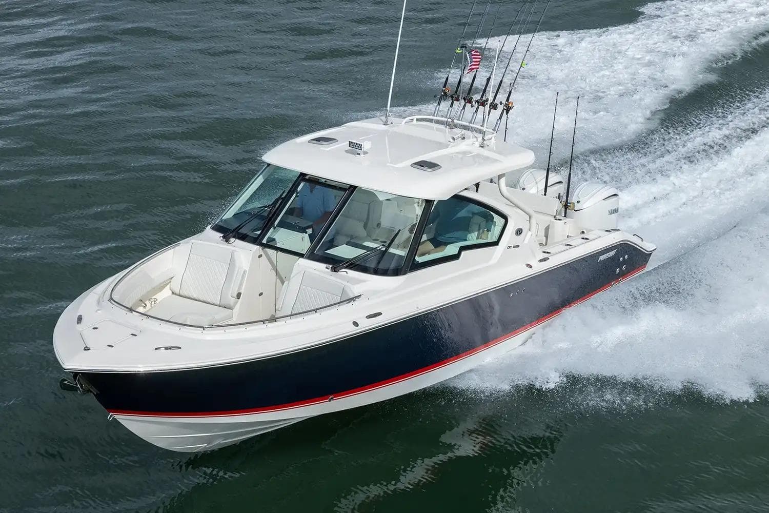 Manufacturer Provided Image: 2026 Pursuit DC 326 Dual Console boat cruising on open water.
