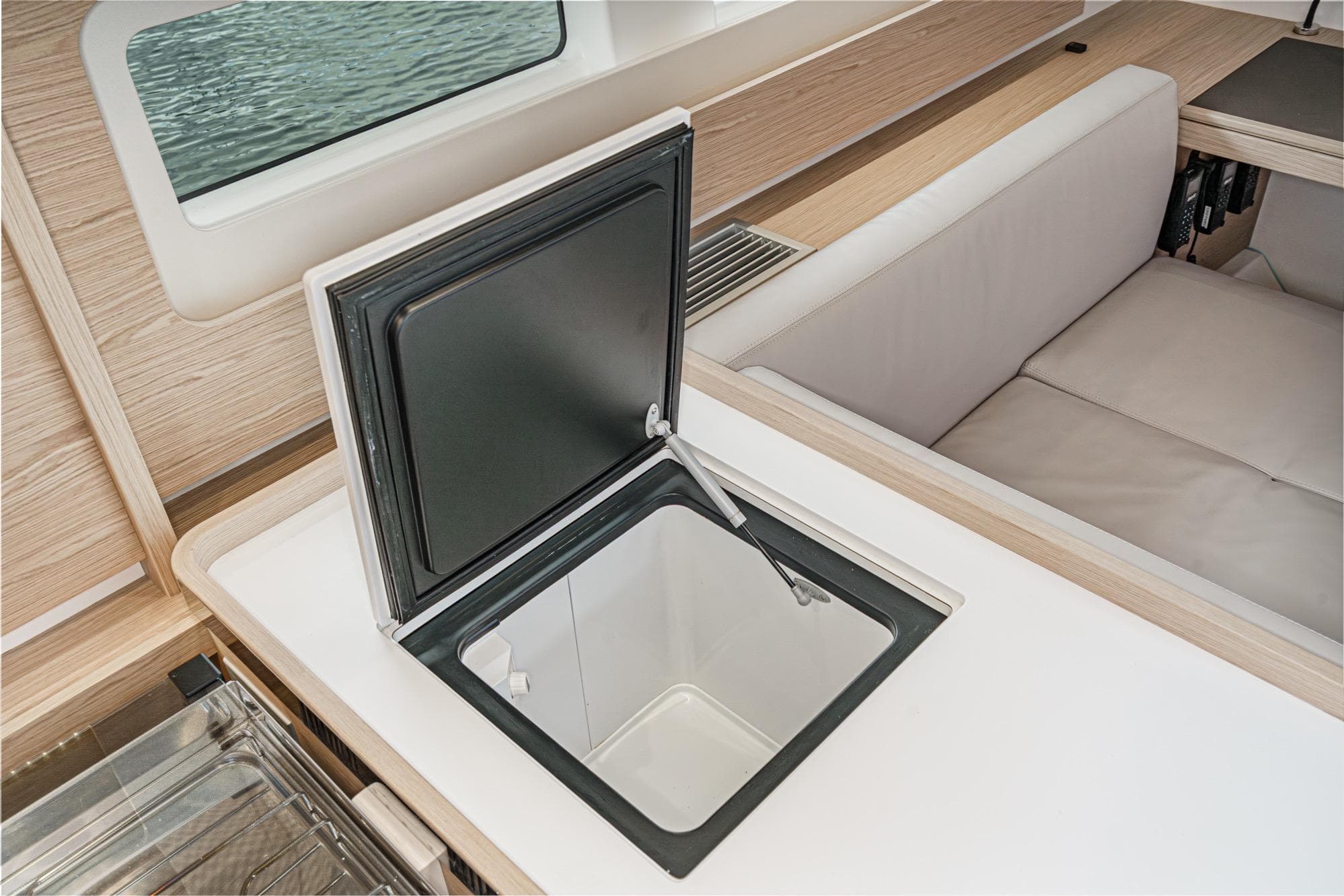 Interior of 2022 Beneteau Oceanis Yacht 54, featuring a sleek built-in storage compartment.