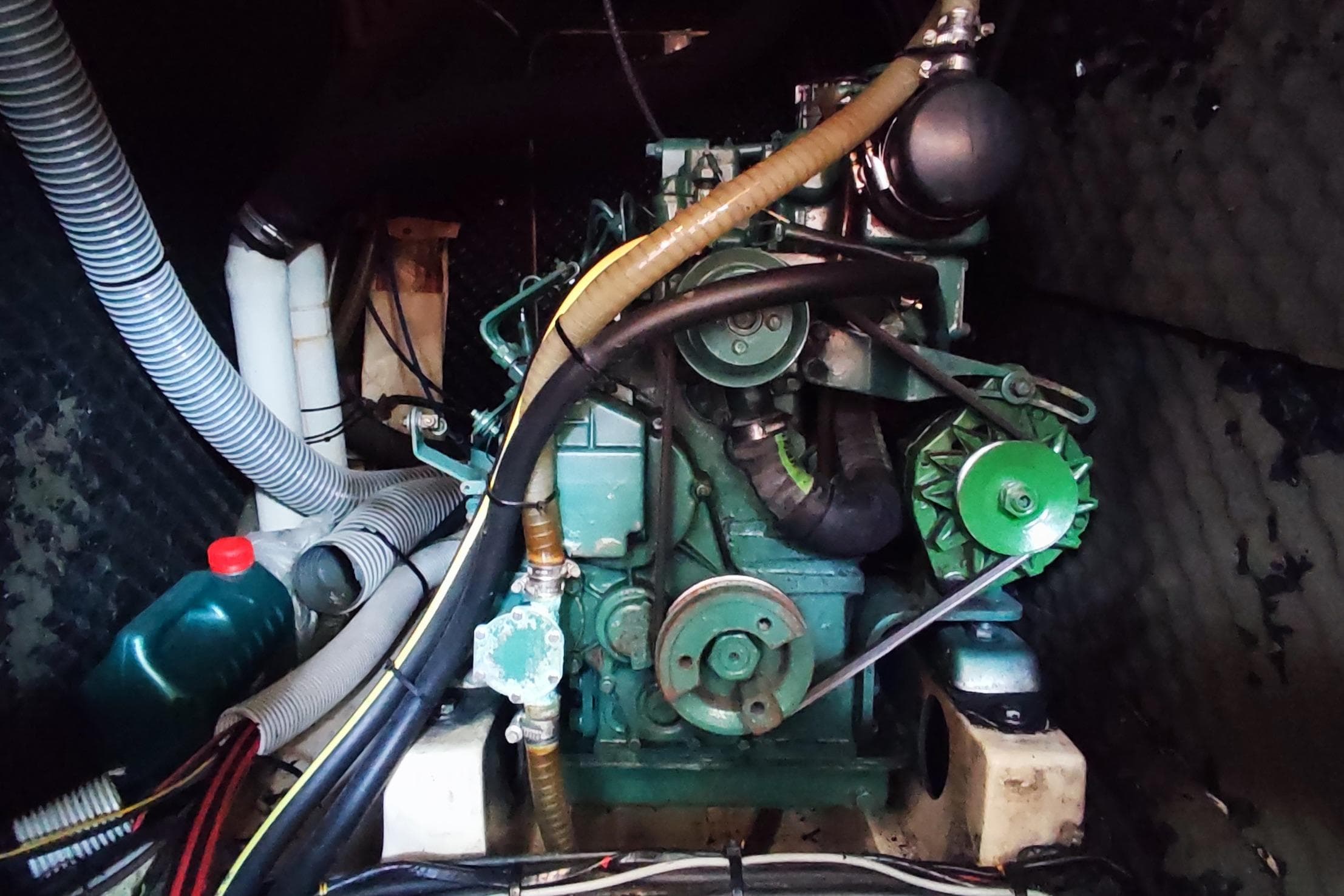 Engine compartment of a 1997 Beneteau Oceanis 36 CC sailboat, showcasing mechanical components.