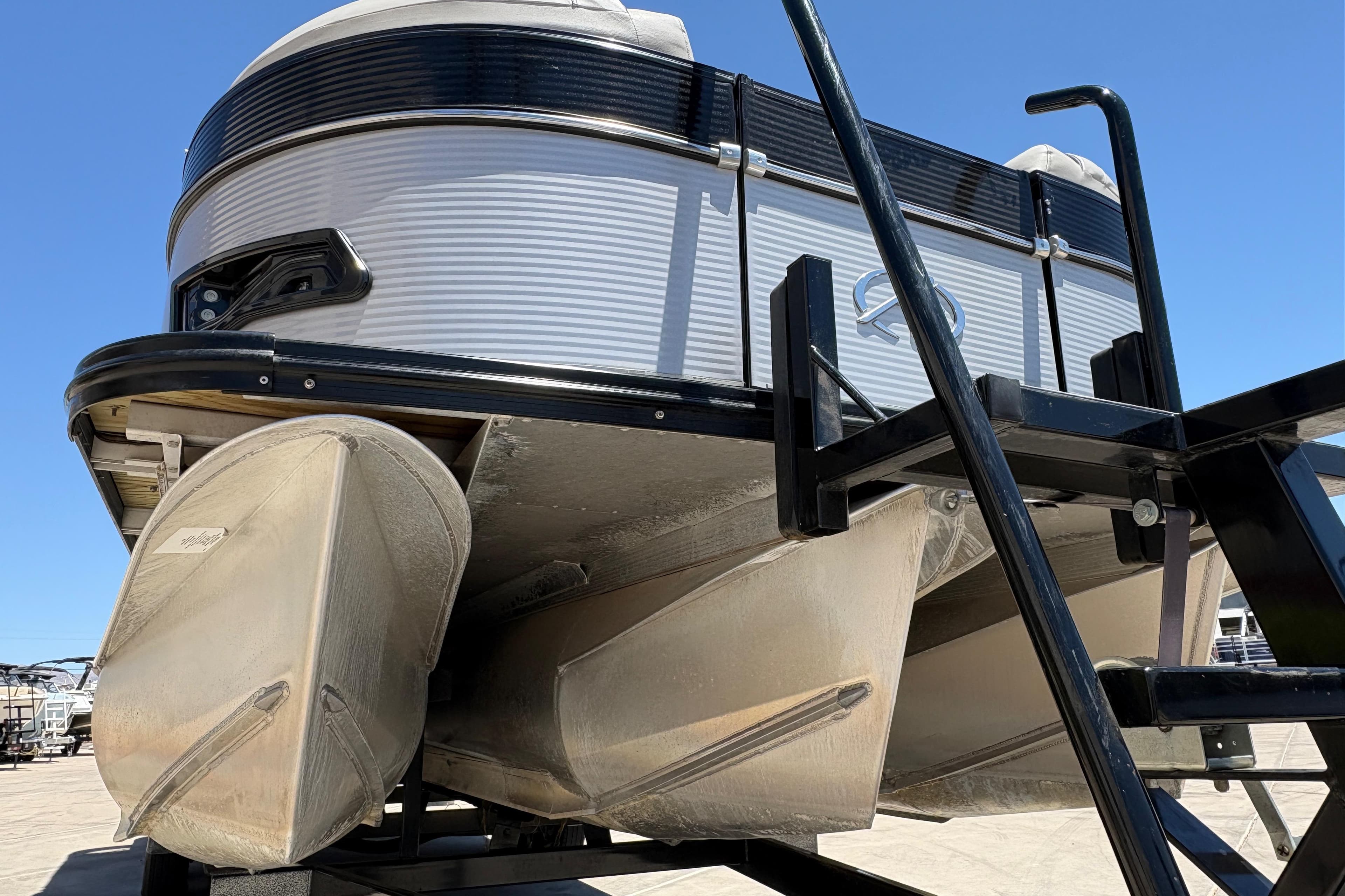 2018 Avalon Catalina Platinum Entertainer Funship pontoon boat on trailer, viewed from below.