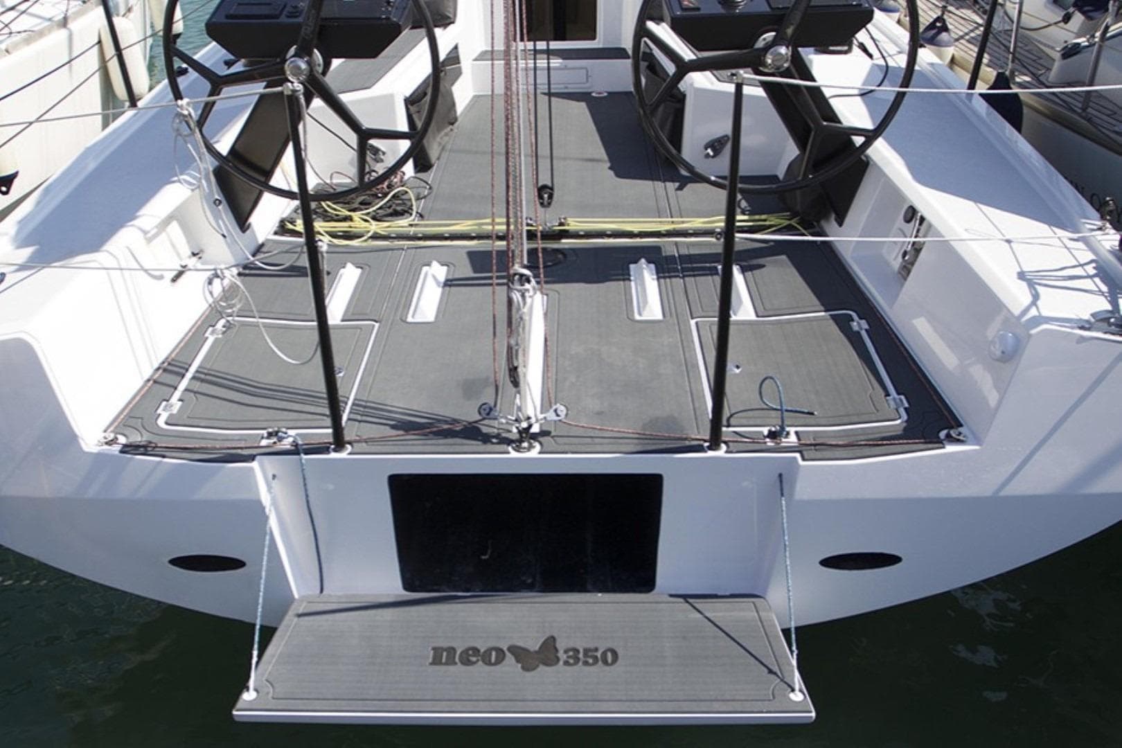 Sleek 2018 Neo 350 yacht deck with dual steering wheels and modern design.