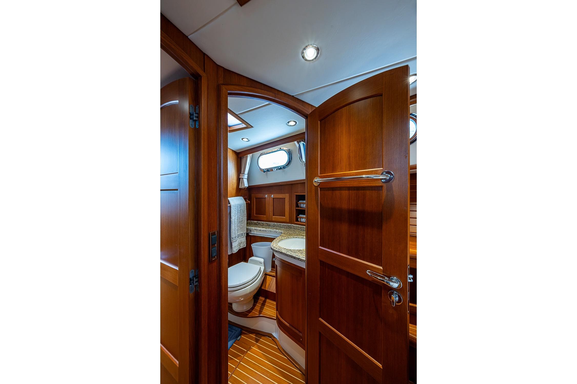 Luxurious wooden bathroom interior on 2014 Grand Banks 46 Eastbay SX yacht.