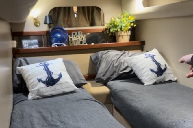 Interior of 2000 Cruisers 3870 yacht with twin beds and nautical decor.
