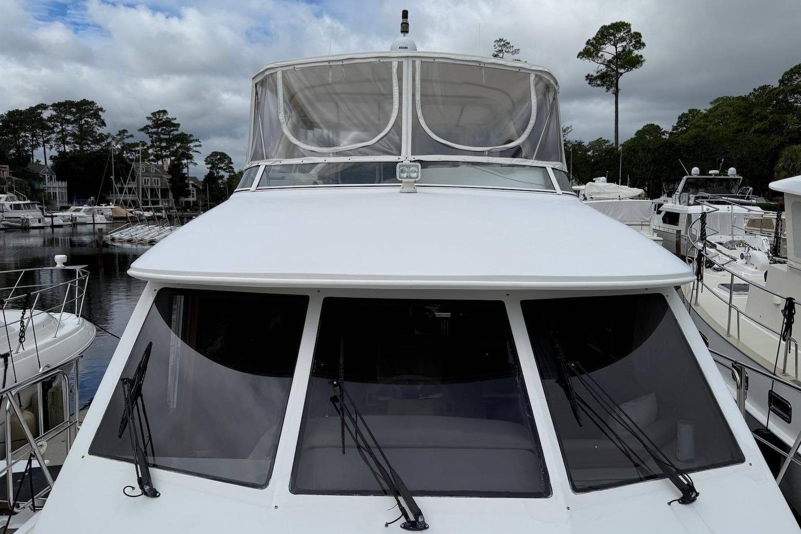 Front view of a 2004 Navigator 4800 yacht docked at a marina.