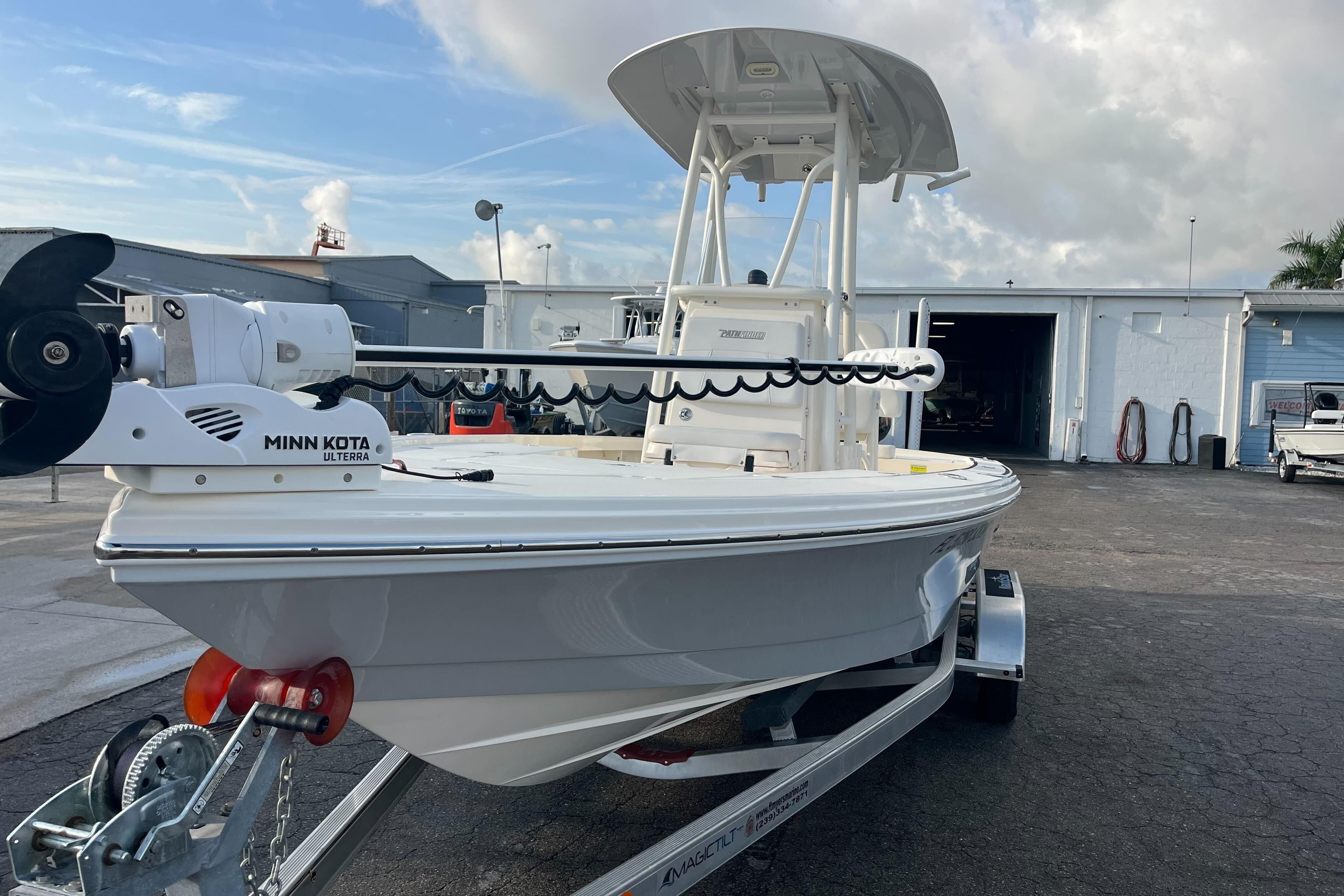 2019 Pursuit S 288 Sport boat with Minn Kota motor on trailer.