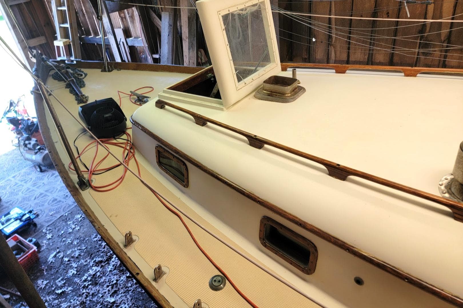 1968 Cheoy Lee Herreshoff 31 Offshore Ketch in a workshop, showing deck and cabin details.