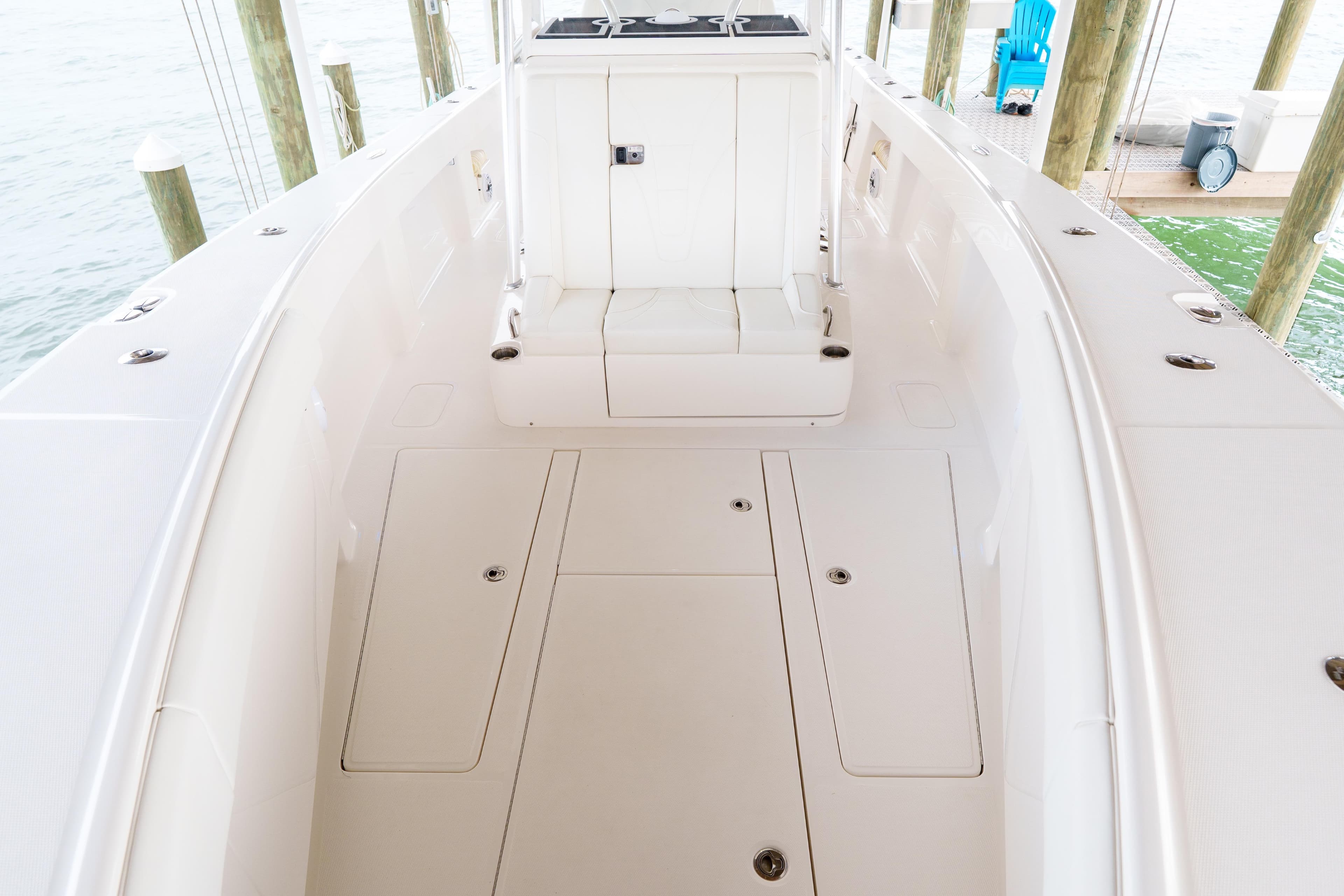 2022 SeaVee 370Z boat deck with storage compartments and seating.