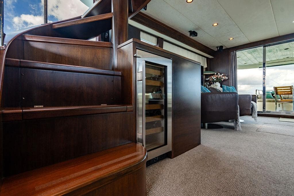 Luxurious Lanzarote Ventuno 73 yacht interior with wooden staircase and modern lounge area, 2013 model.