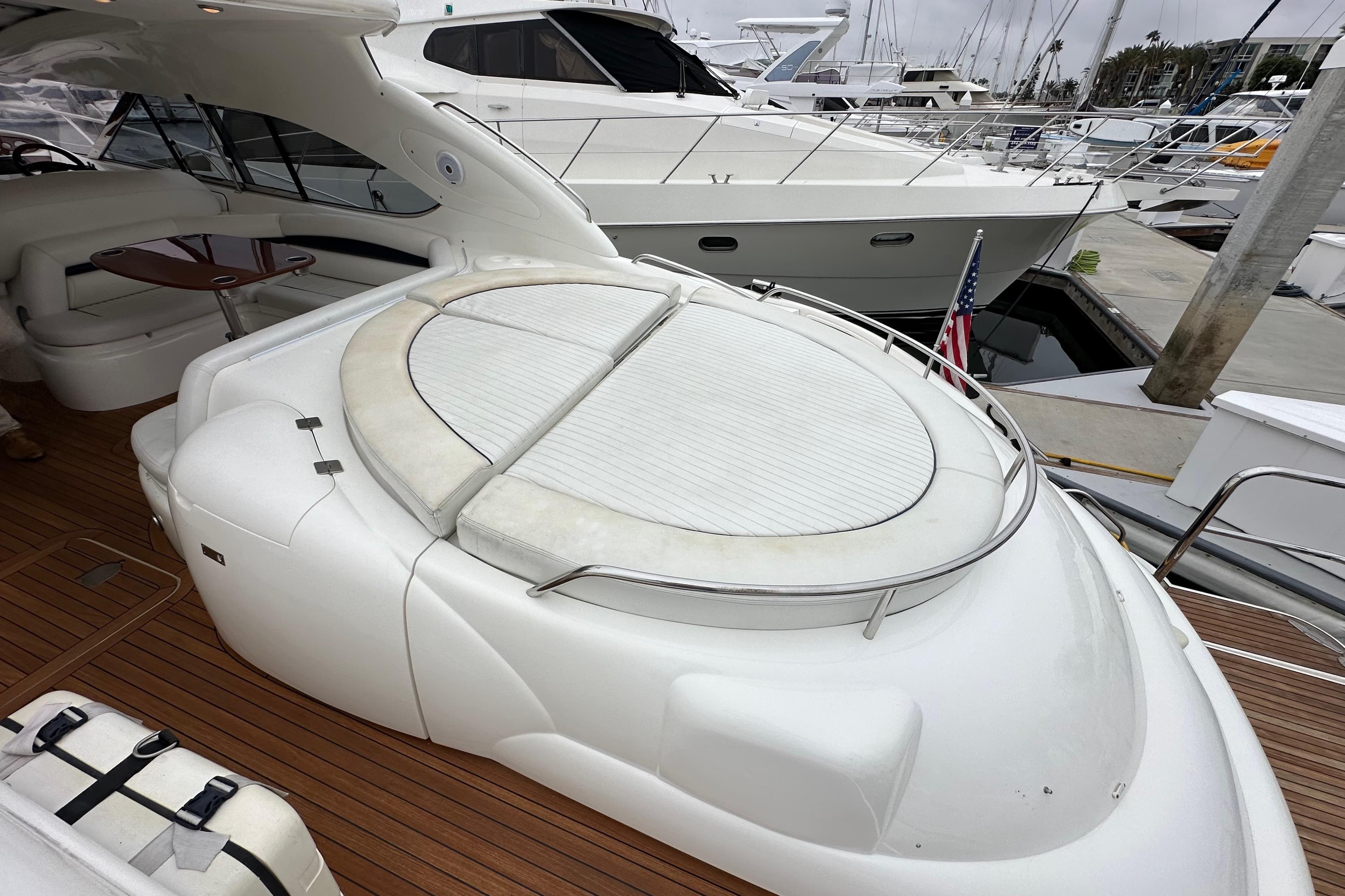 Luxurious 2000 Sunseeker Predator 60 yacht with spacious deck and elegant seating area.