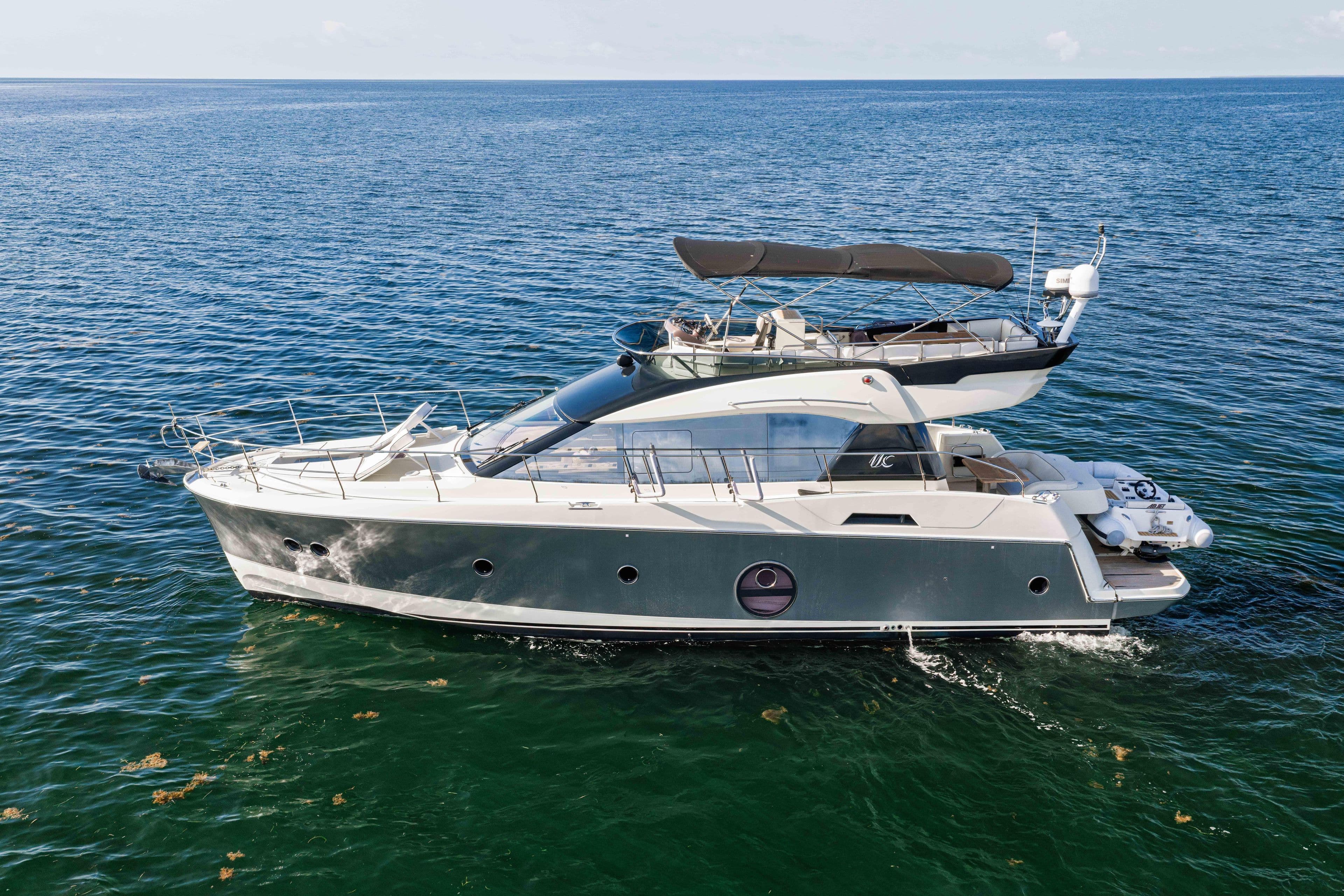 2017 Monte Carlo Yachts MC5 cruising on open water, showcasing sleek design and luxury features.