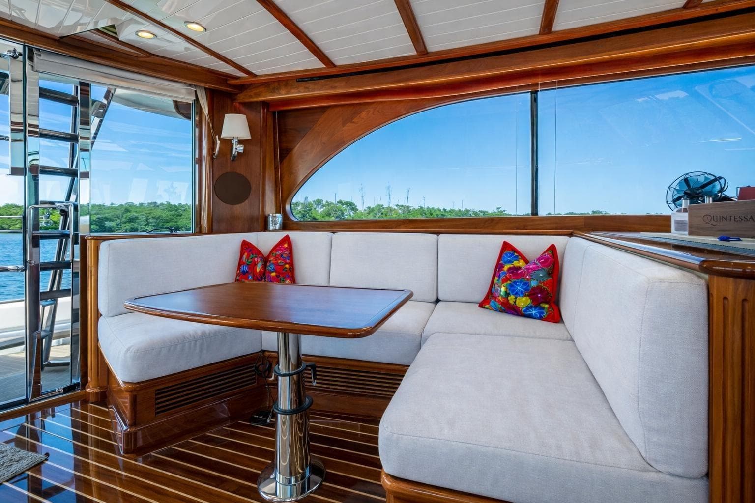 Luxurious 2021 Hinckley Talaria yacht interior with elegant wood finish and plush seating.