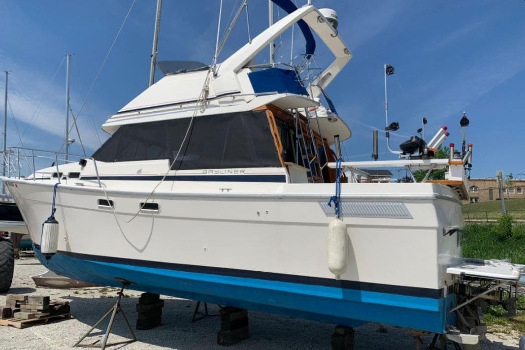 1986 Bayliner 3270 Motoryacht on dry dock, showcasing its sleek design and structure.