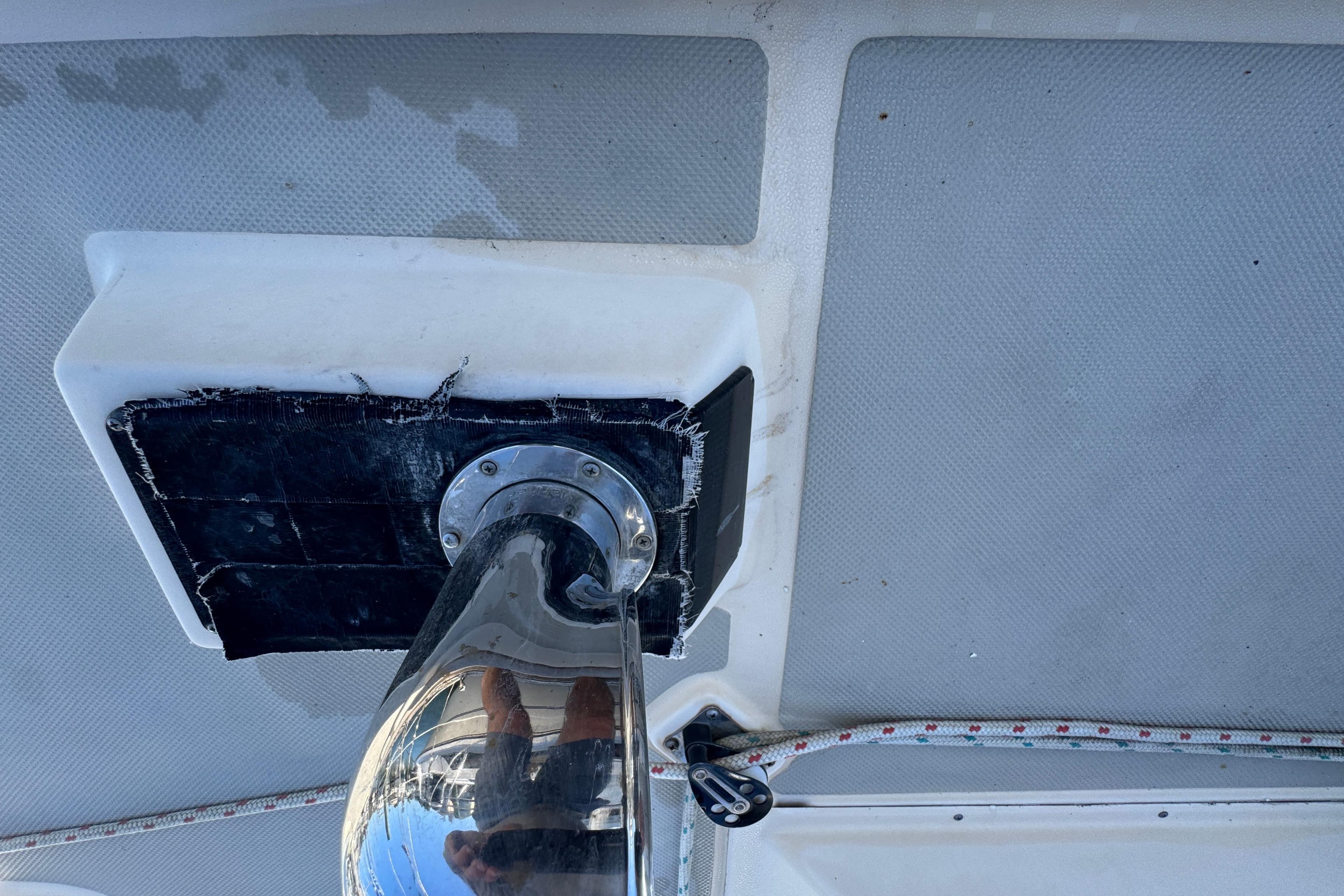 Close-up of a 1991 Island Packet Yachts 38 deck fitting with visible wear.