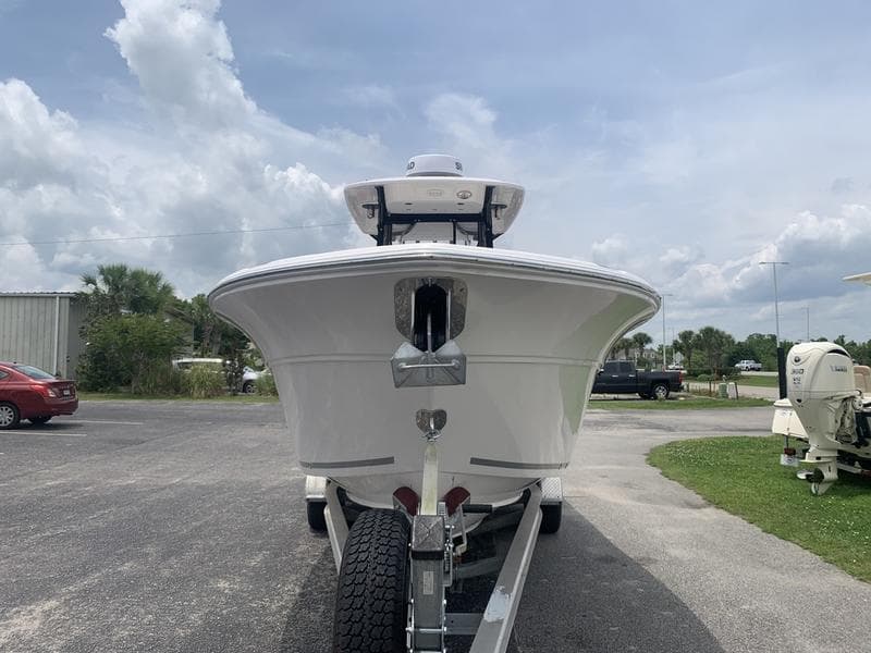 2023 Sea Fox 268 Commander boat on trailer, front view, under cloudy sky.