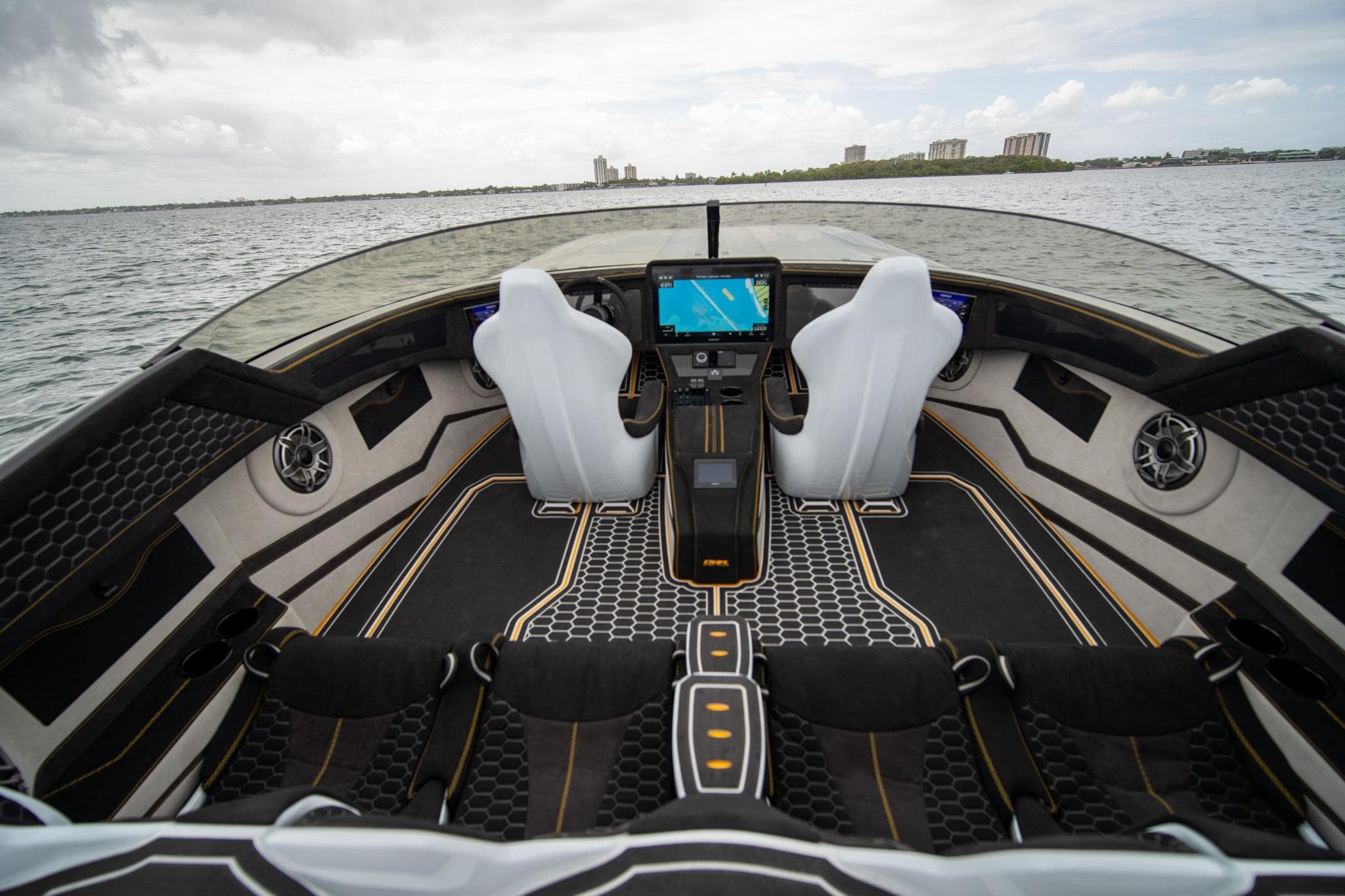 Interior of 2026 Doug Wright 36 boat with modern dashboard and sleek seating design.