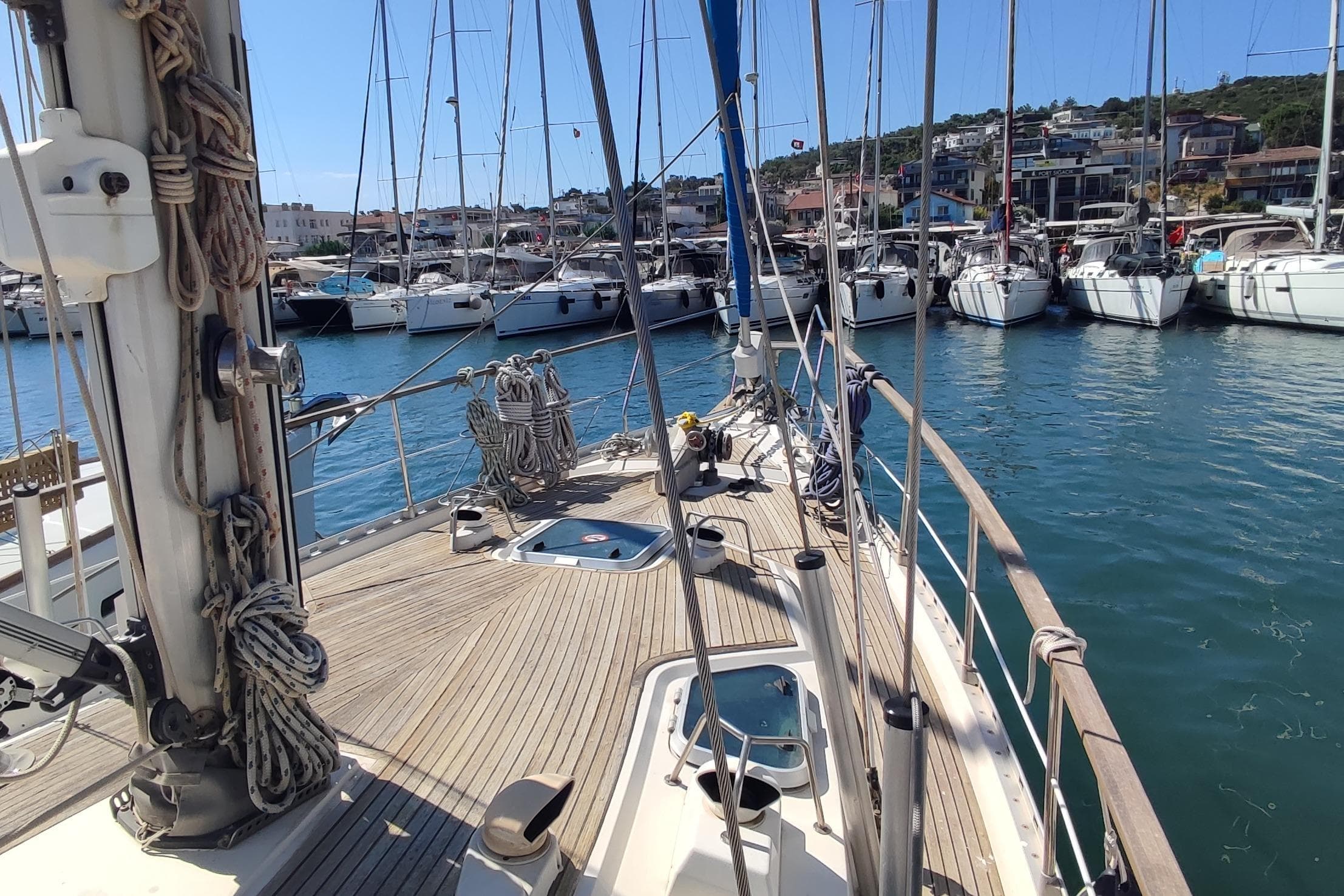 Sailboat Nauticat 42, 1997 model, docked in a marina with other boats.