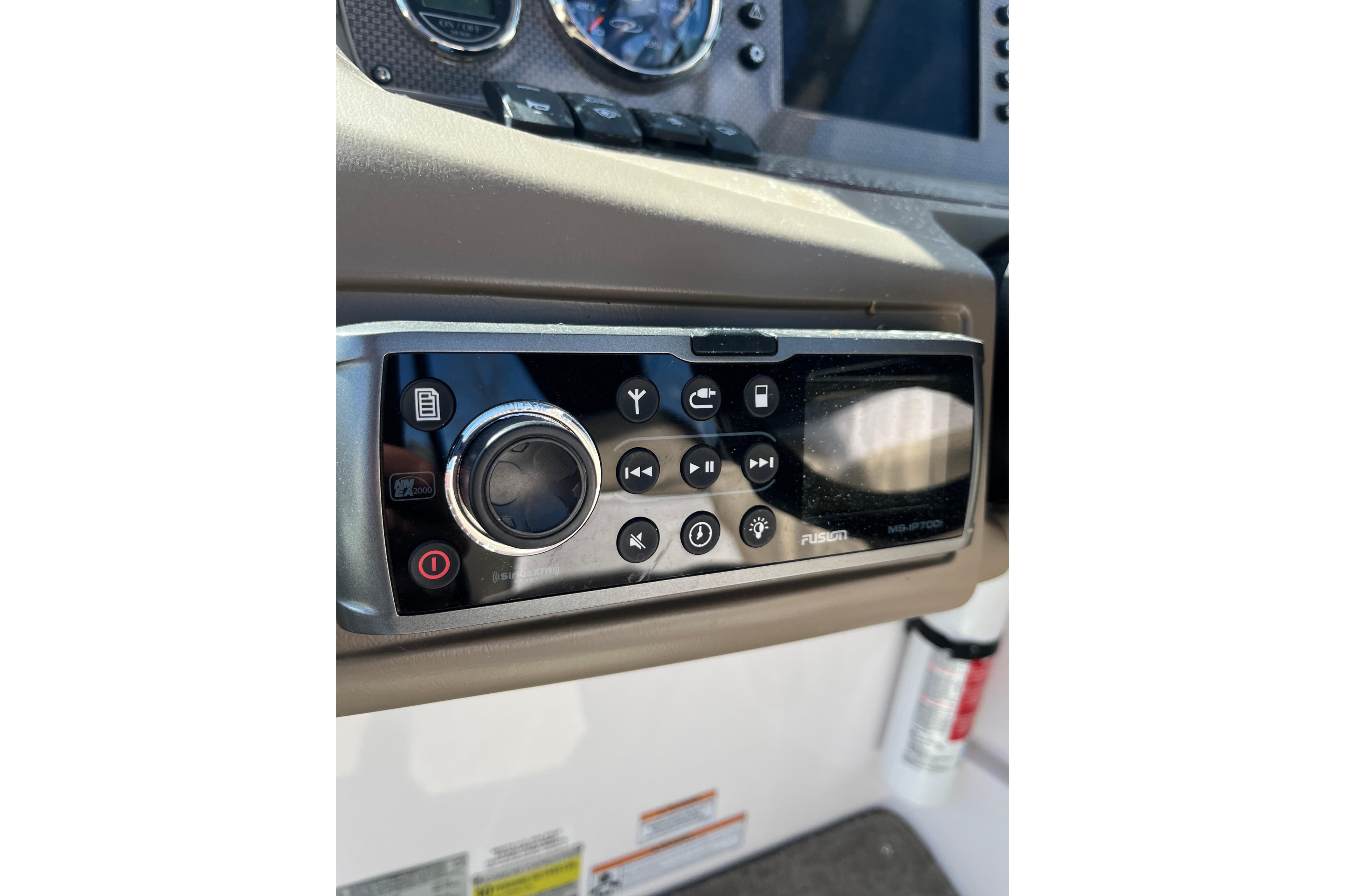 Control panel of a 2015 Regal 2250 Cuddy boat with Fusion stereo system.