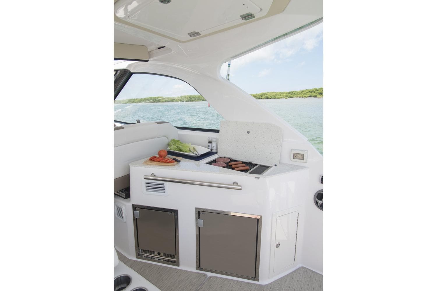Manufacturer Provided Image: 2017 Regal 35 Sport Coupe yacht interior with a built-in grill and storage.