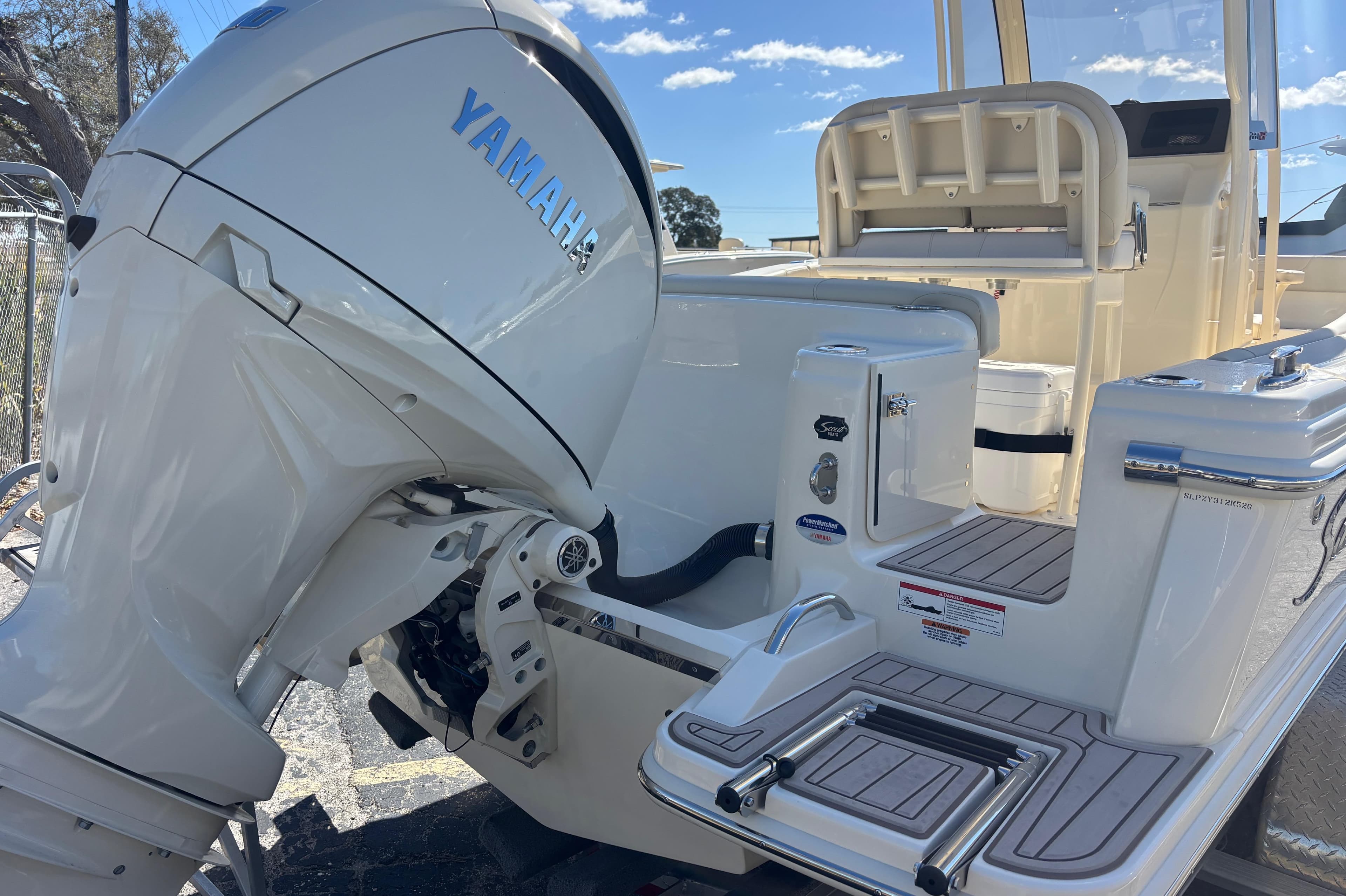 2026 Scout 220 XSF boat with Yamaha outboard motor, featuring a sleek deck design.