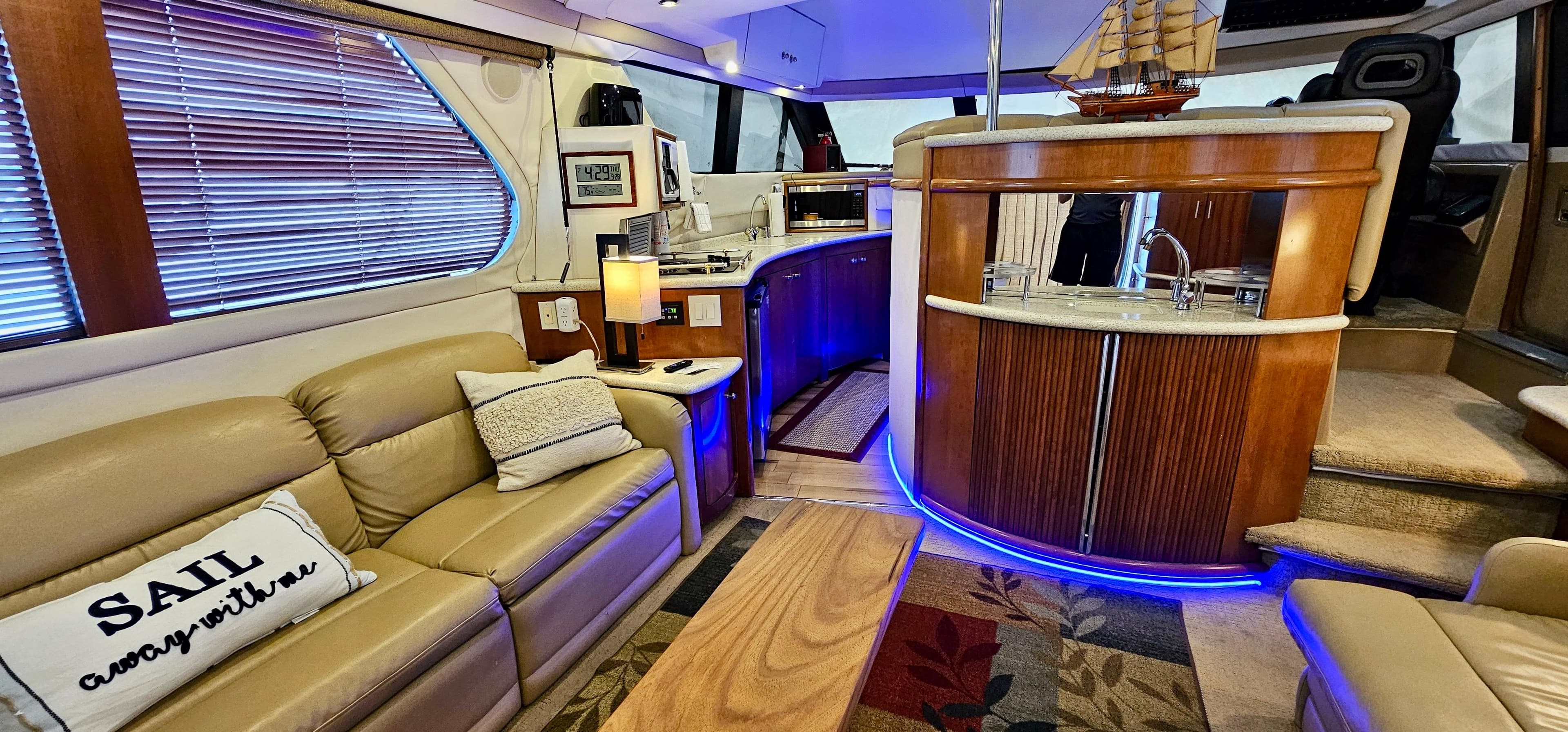 Luxurious interior of a 1999 Carver 450 Pilothouse yacht with modern amenities.
