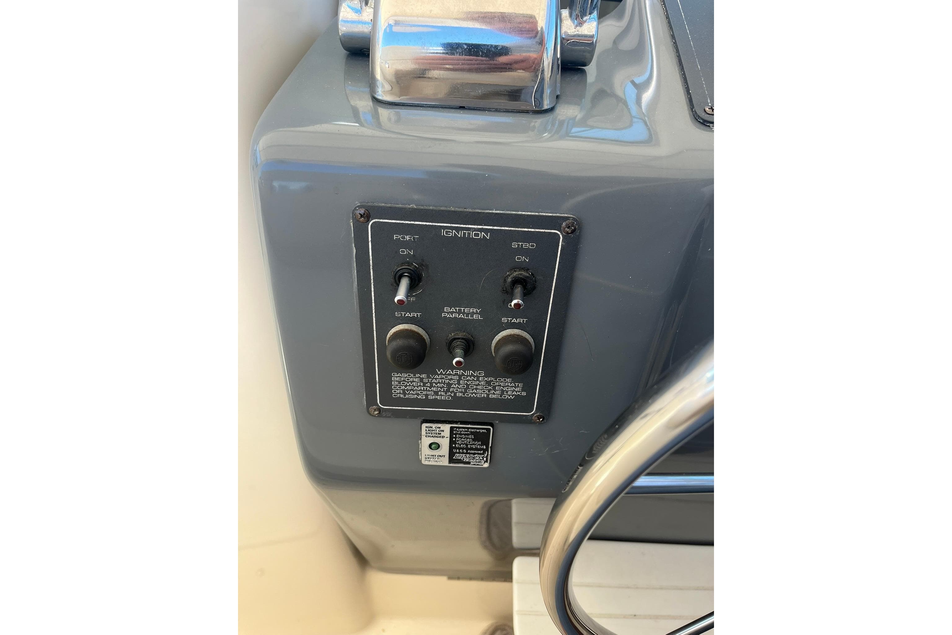 1996 Tiara Yachts 3500 Express ignition panel with controls and warning label.