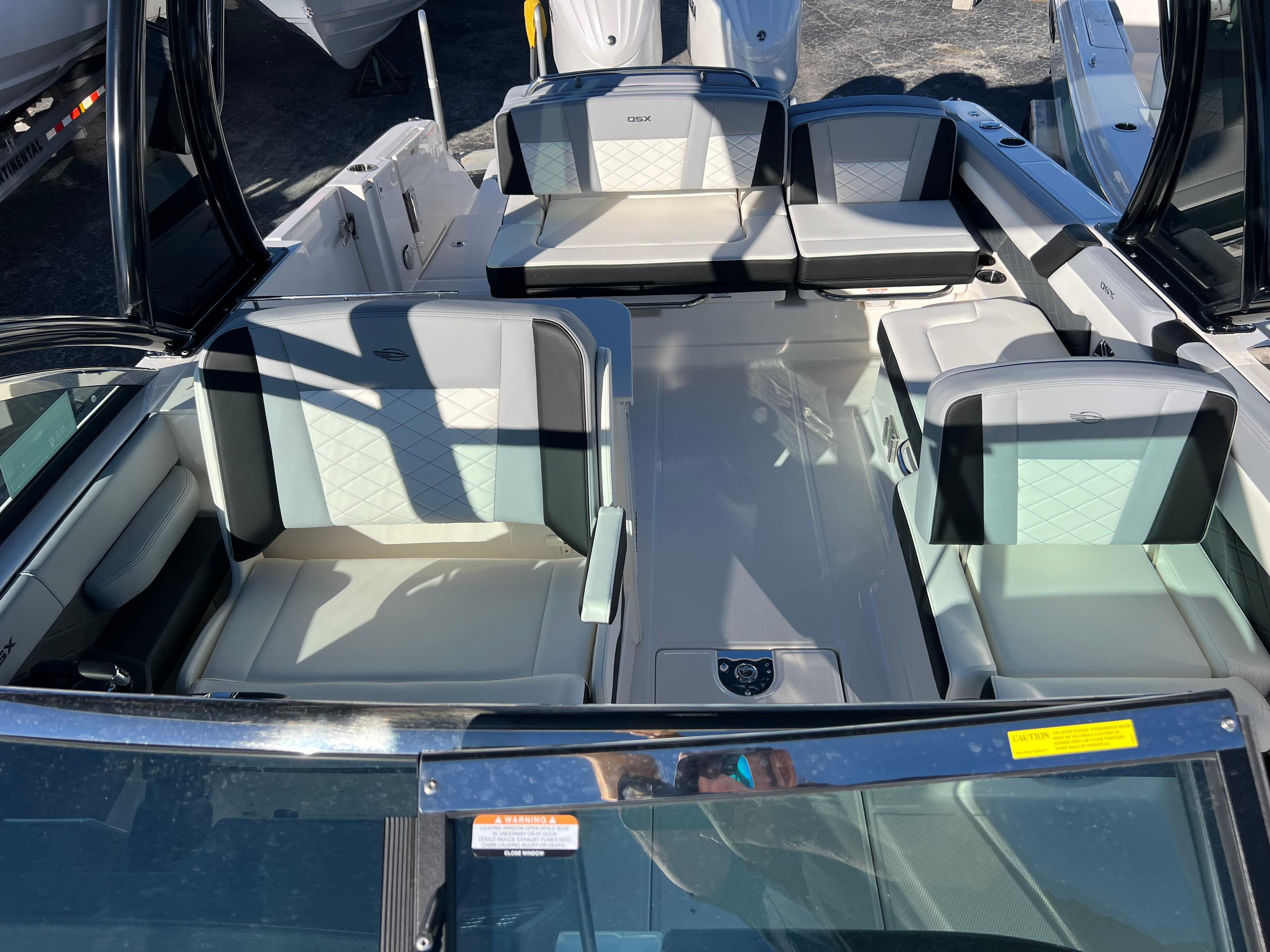 2025 Chaparral 310 OSX boat interior with luxurious seating and modern design.