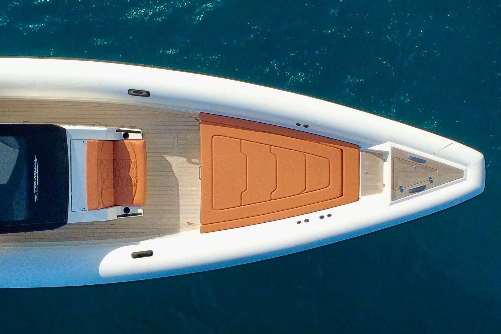 Aerial view of 2025 Technohull 38 Grand Sport luxury boat on blue water.