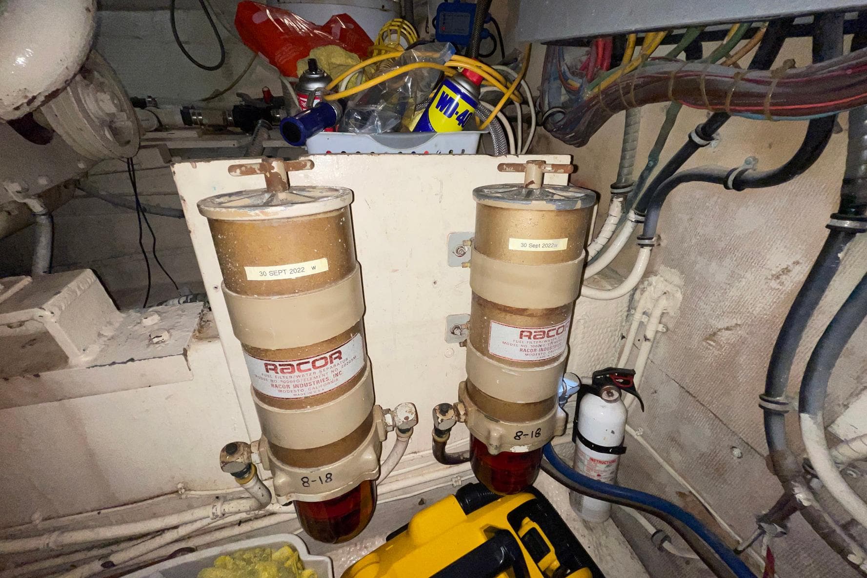 Engine room of 1981 Hatteras 48 Motor Yacht with Racor fuel filters and maintenance tools.