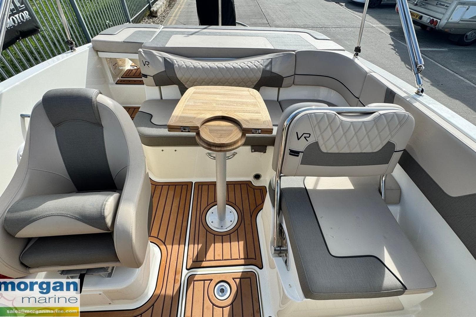2022 Bayliner VR5 Bowrider OB interior with seating and wooden table.