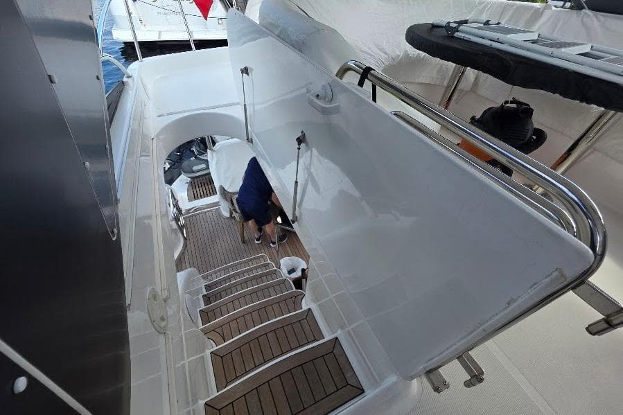 Staircase on 2008 Neptunus Flybridge MY yacht, featuring sleek design and wooden steps.