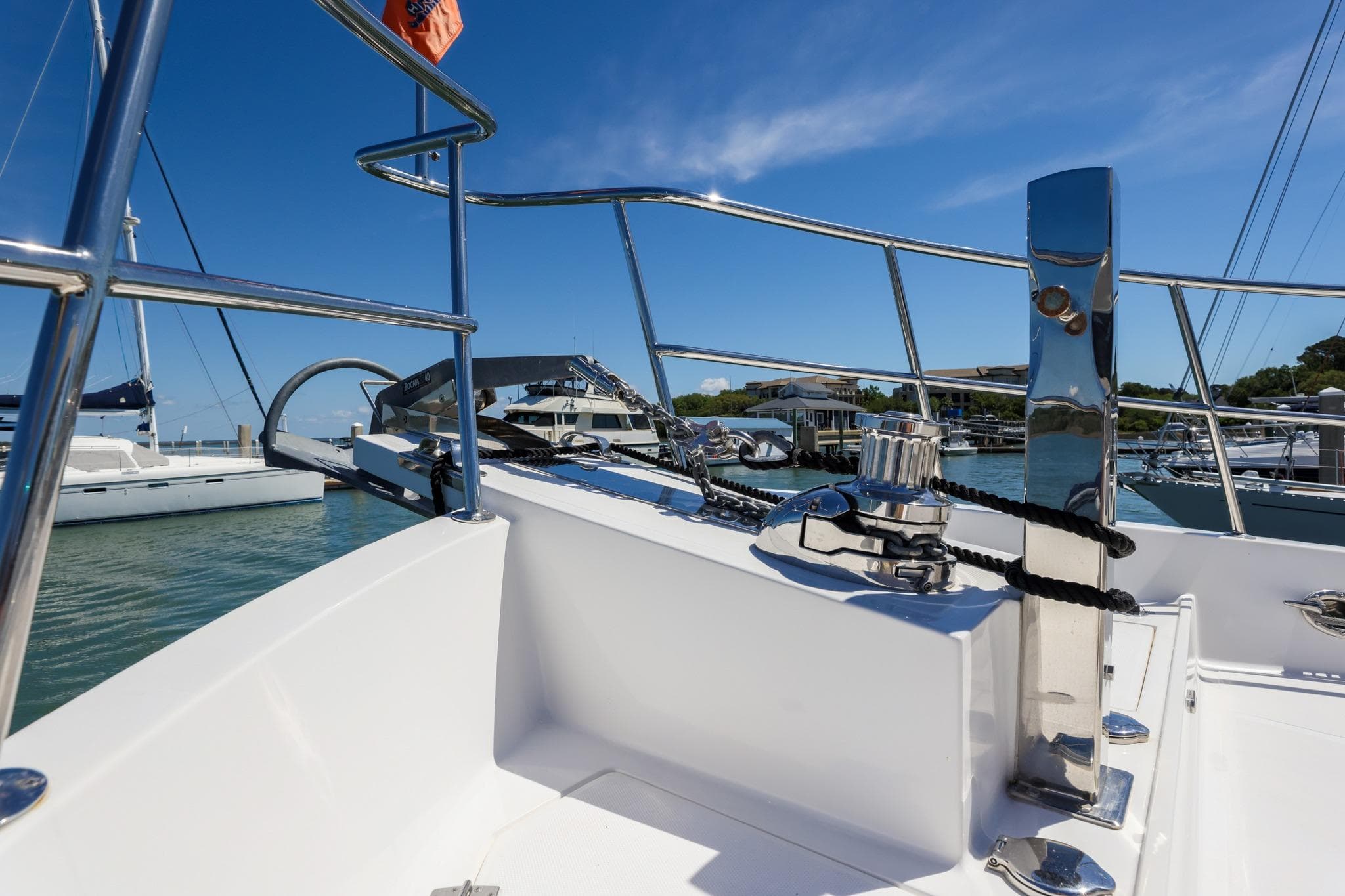 2023 North Pacific 49 Euro yacht deck with chrome railing and marina view.