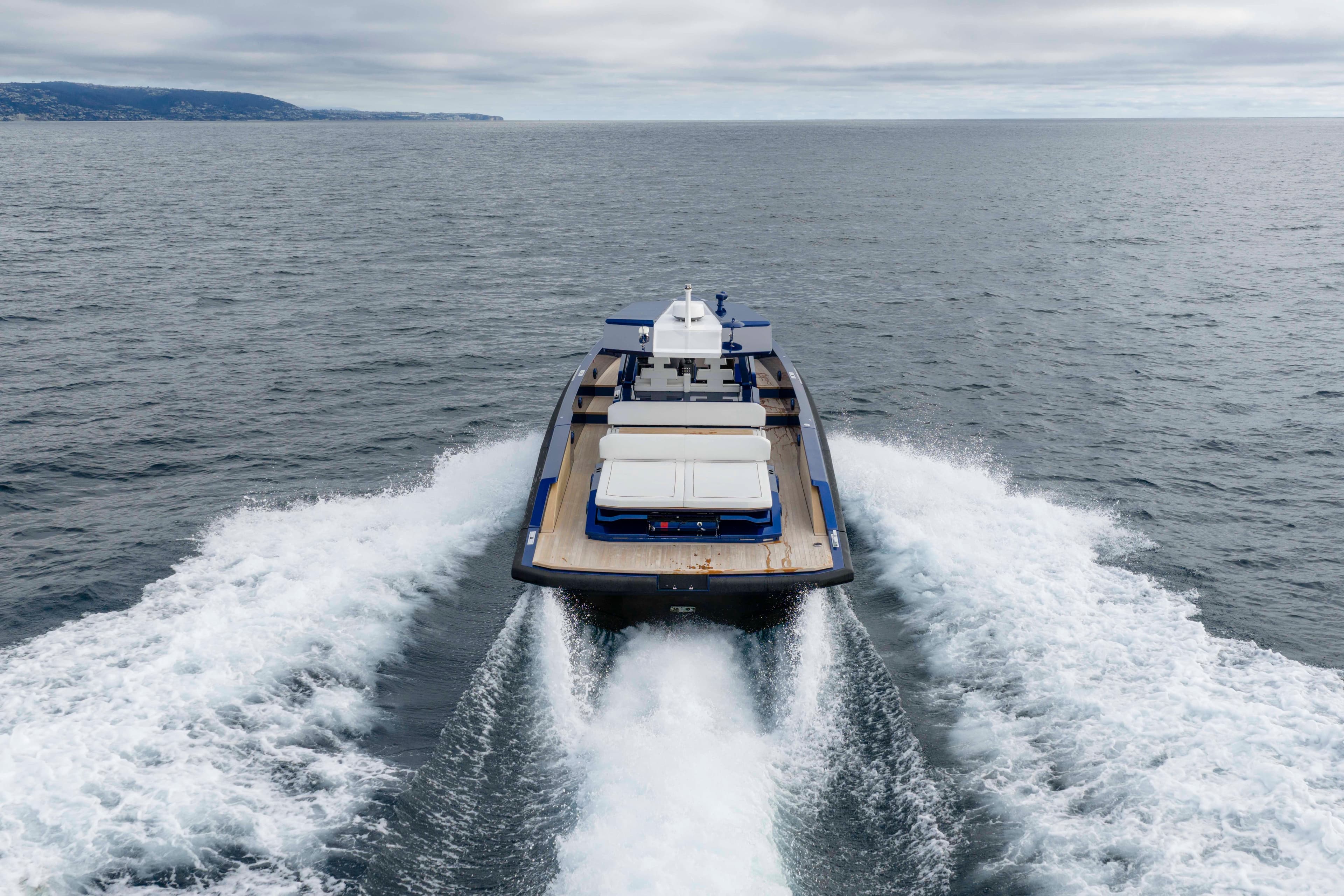 2023 Wally Wallytender 48 cruising on open sea, rear view.