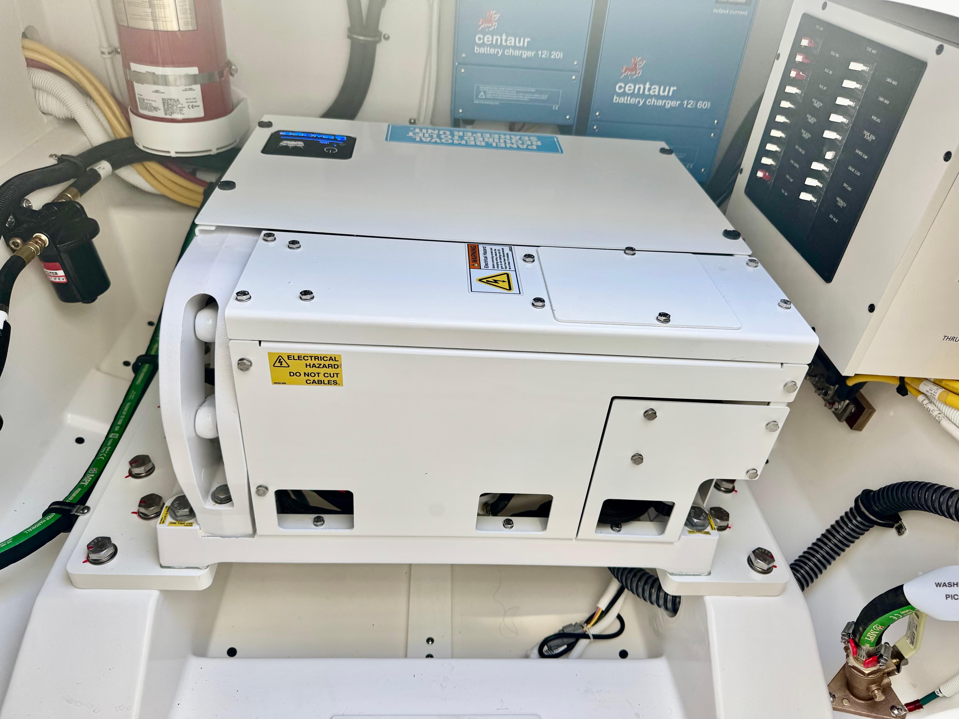 Engine compartment of 2025 Tiara Yachts 34 LX with electrical components and wiring.