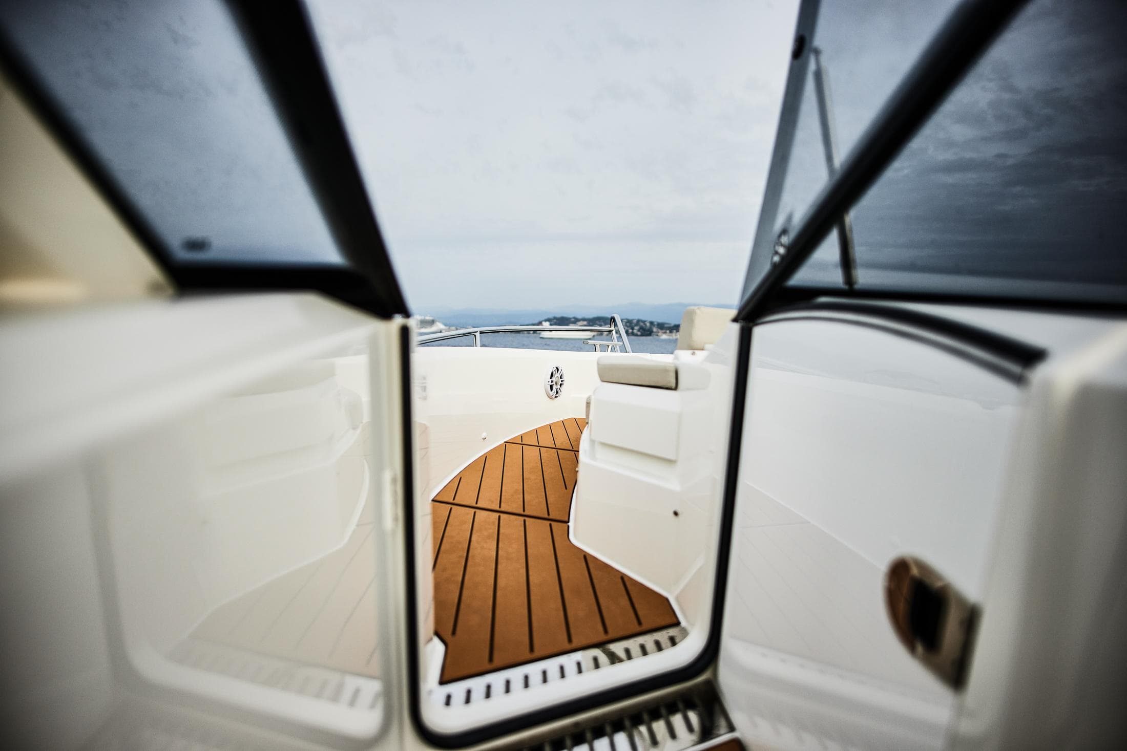 2025 Skamander Sorrento yacht interior with wooden deck and open door view.