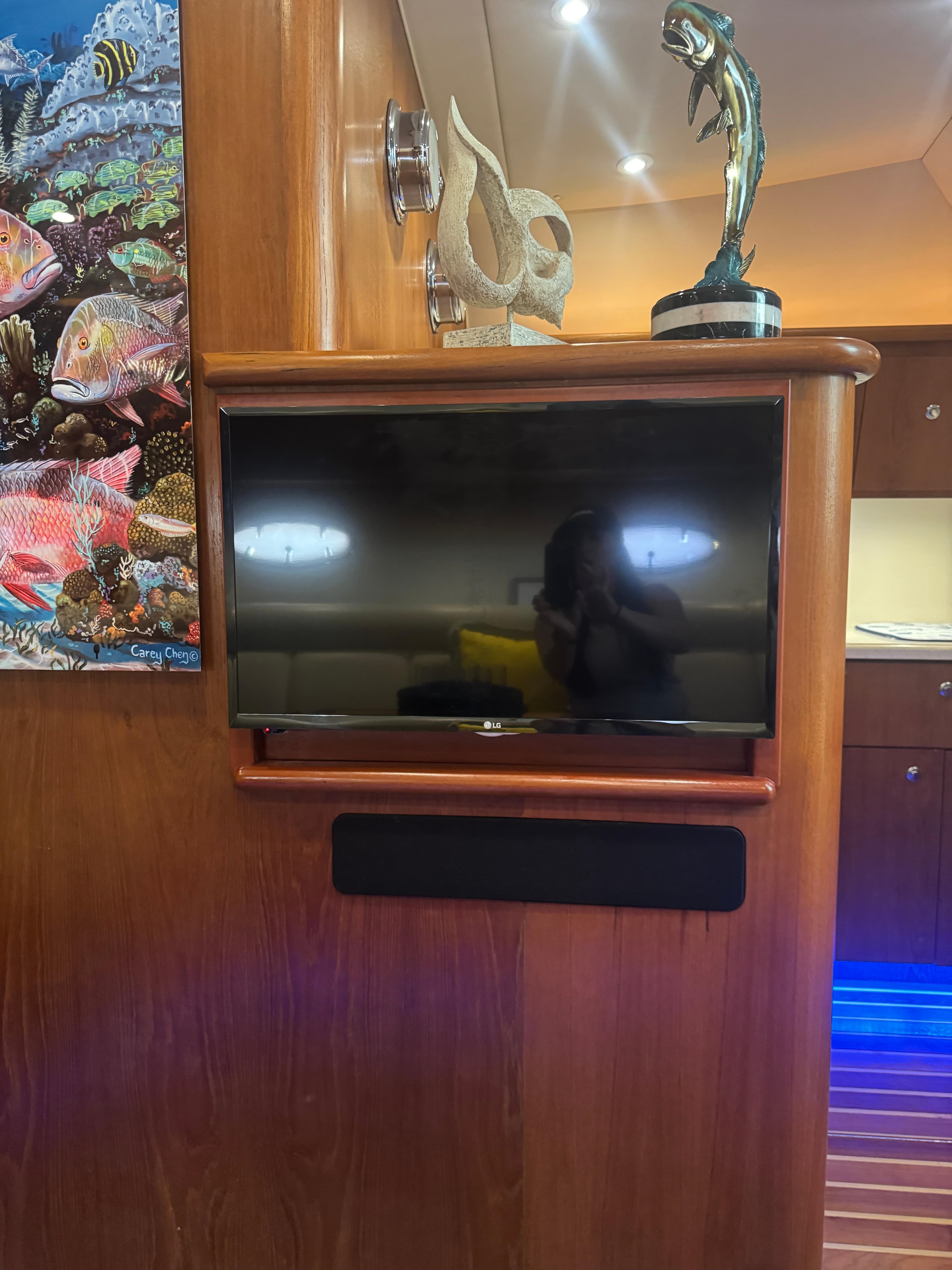 Interior of 2006 Tiara Yachts 4200 Open with TV and marine decor.