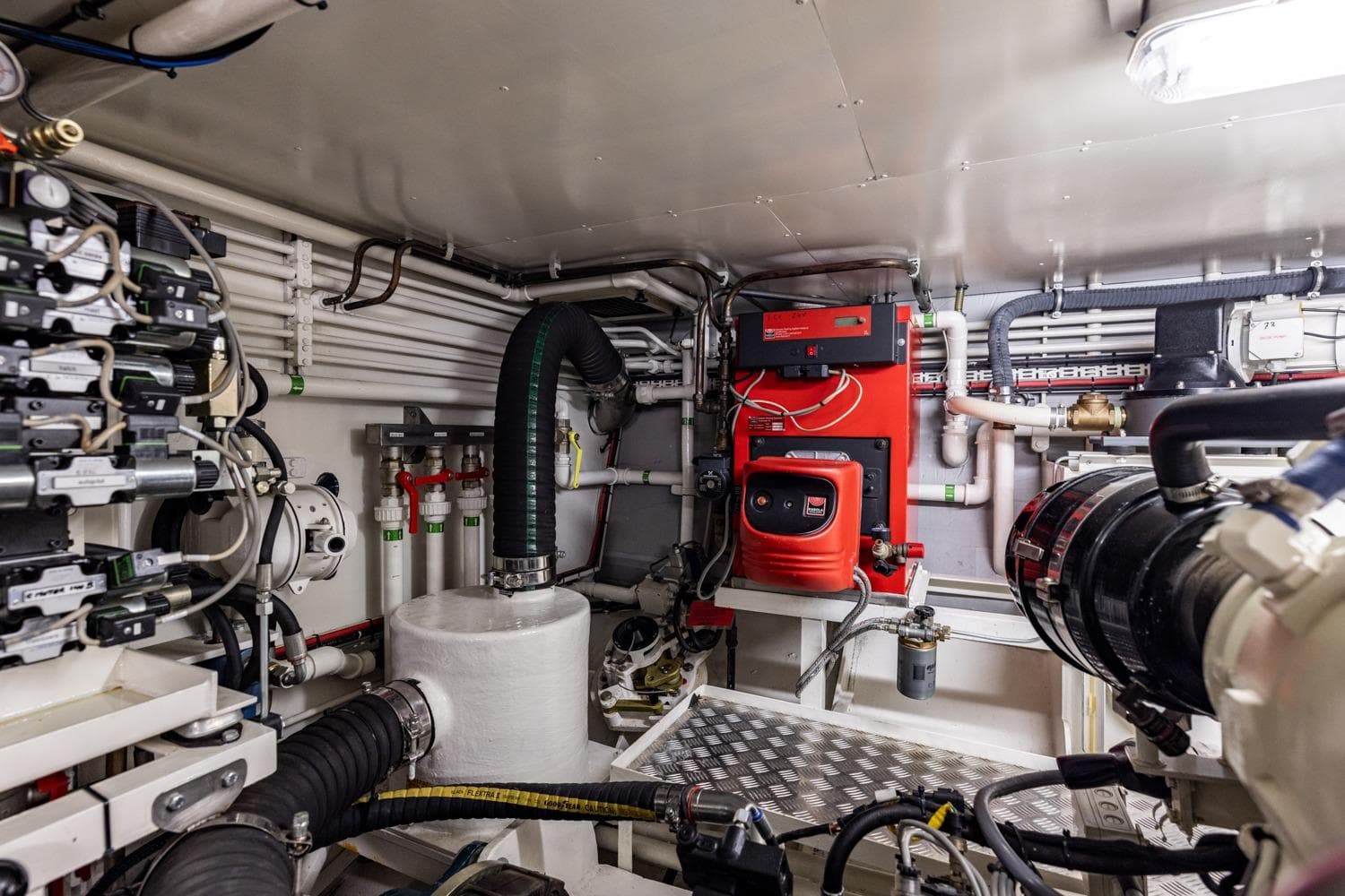 Engine room of 2009 Mulder 70 Wheelhouse CLASY yacht, featuring complex piping and machinery.