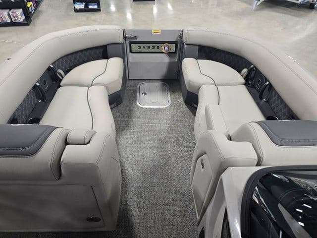 Luxurious seating area of 2025 Barletta Boats R23UCA with plush upholstery.