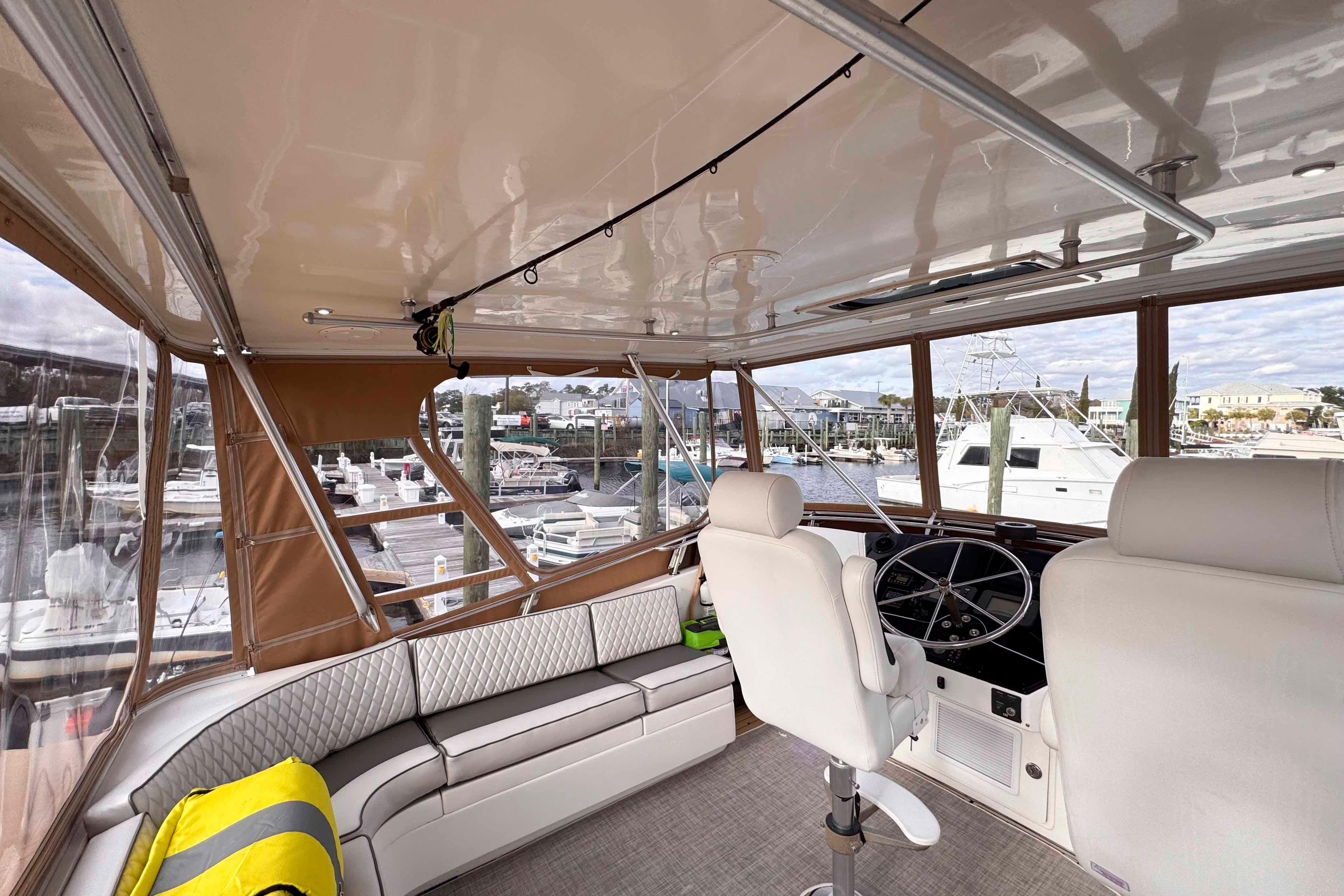 Interior of 2007 Albin 45 Command Bridge yacht with helm and seating area.