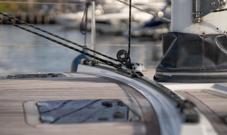 Deck of 2014 Discovery 57 yacht with rigging and hatch details.