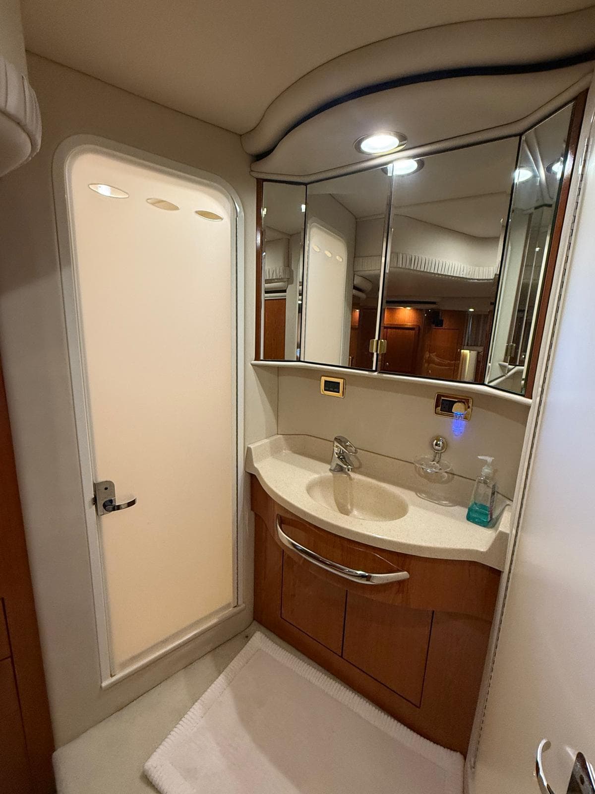 Bathroom interior of 2001 Sea Ray 540 Cockpit Motor Yacht, featuring modern fixtures and cabinetry.