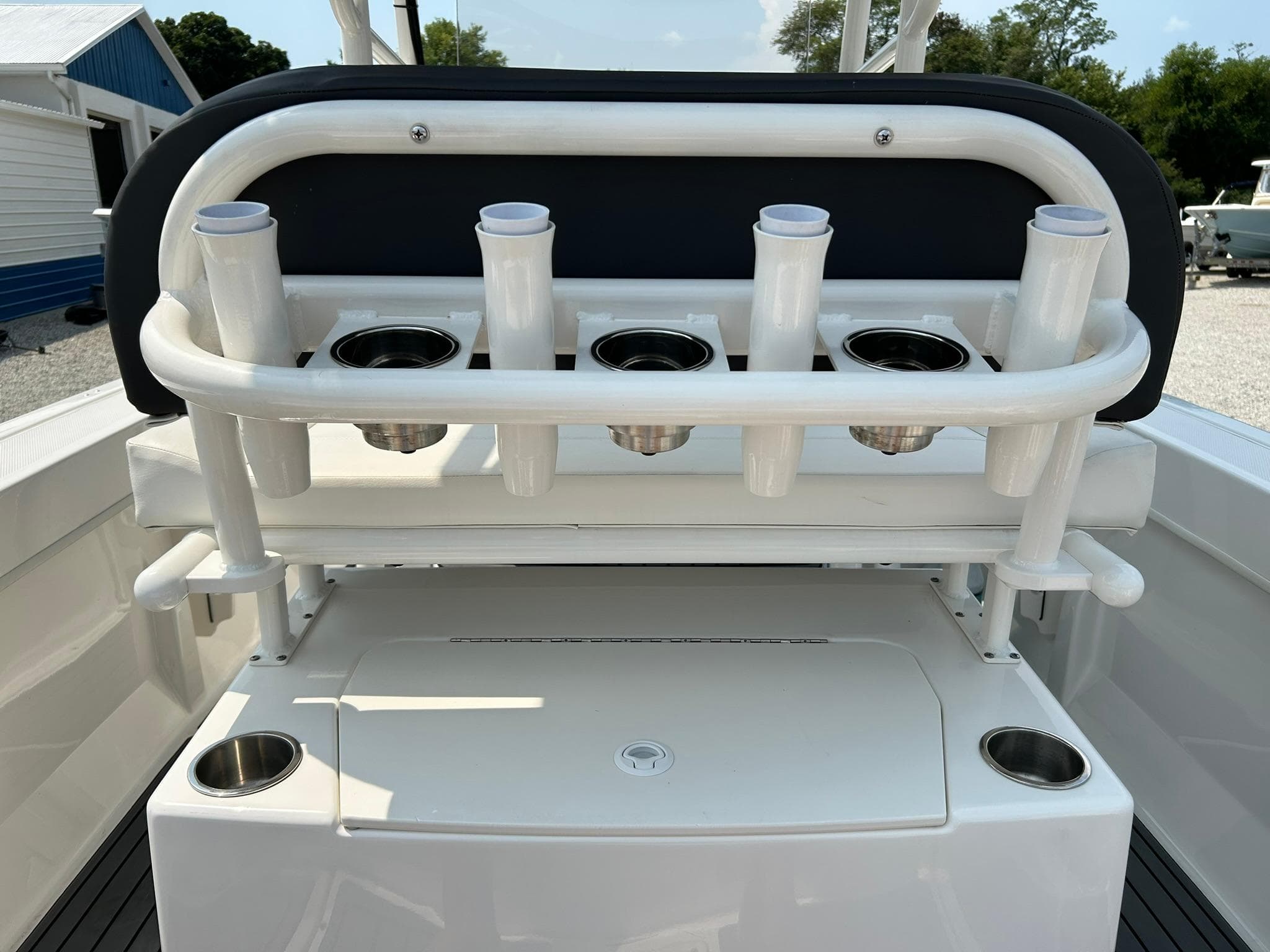 2022 Bayliner Trophy T20CX boat with rod holders and storage compartment.