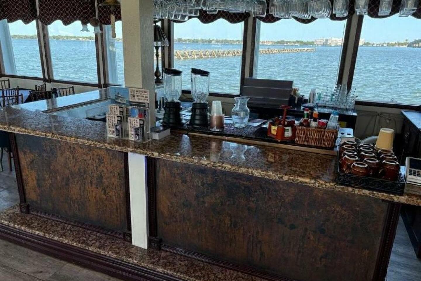 Bar area on a 1984 Custom Paddle Wheel boat with scenic water views.