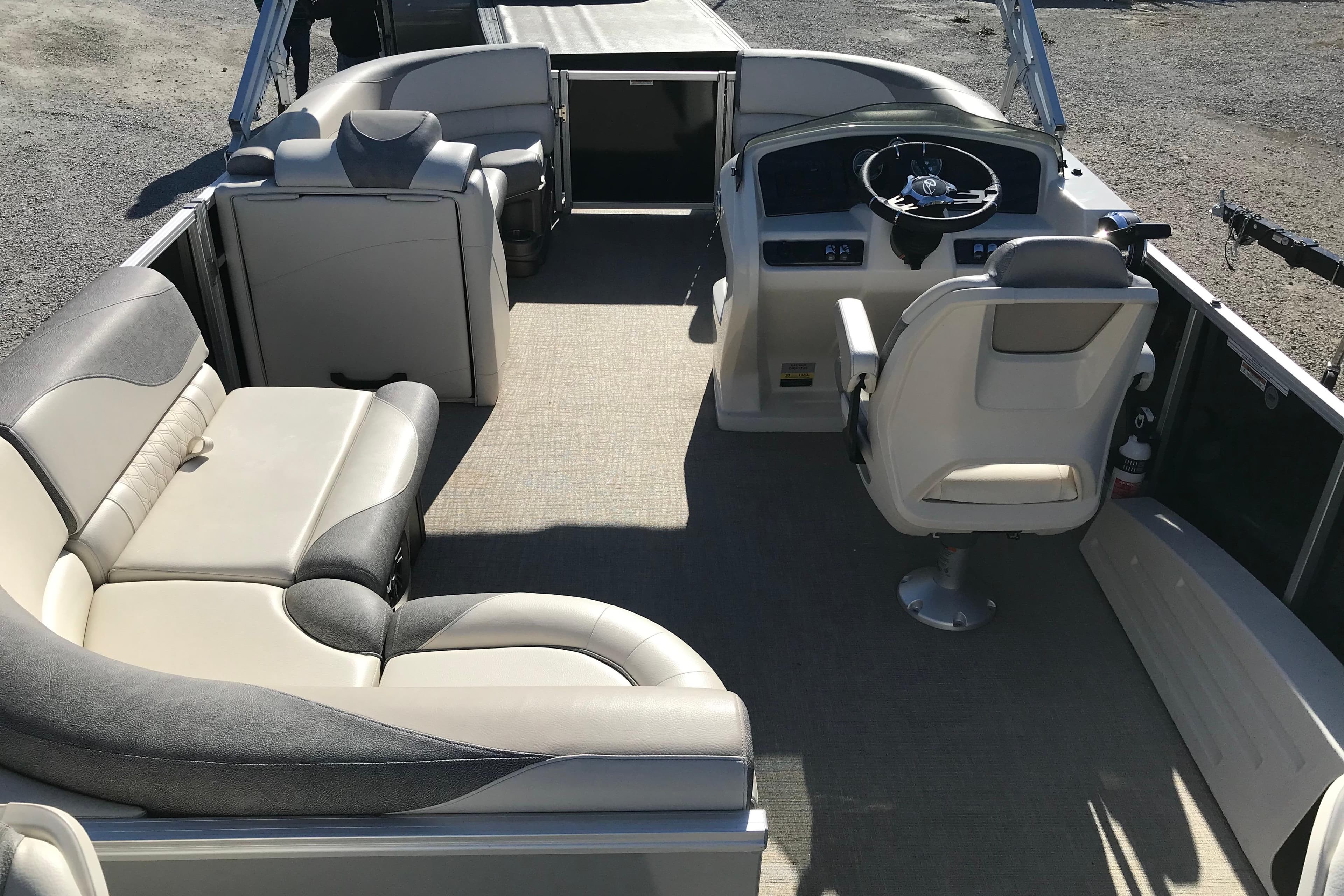 2023 Avalon LSZ Rear Fish boat interior with plush seating and steering console.