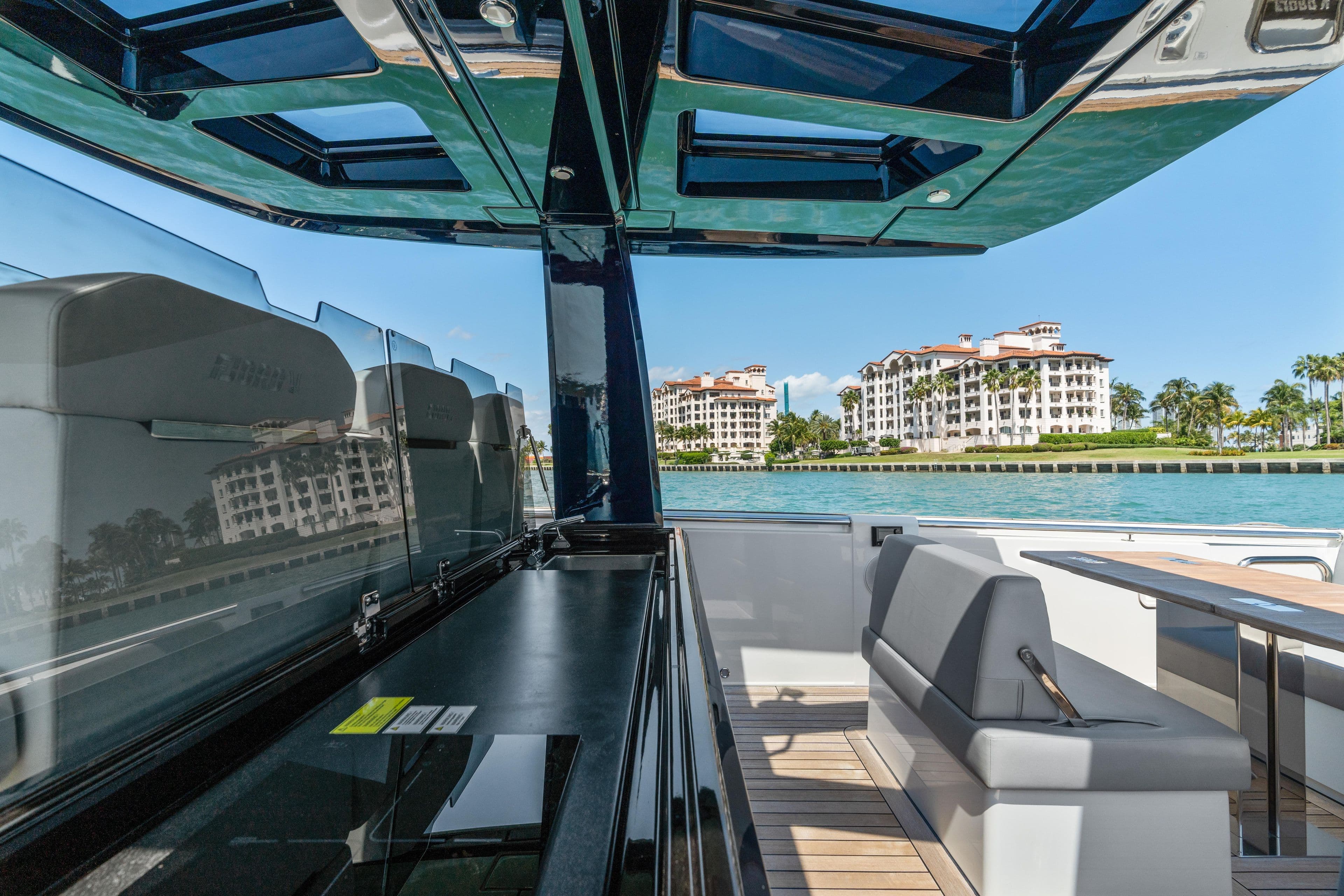 Luxurious 2022 Fjord 44 Open yacht interior with waterfront view and modern seating.
