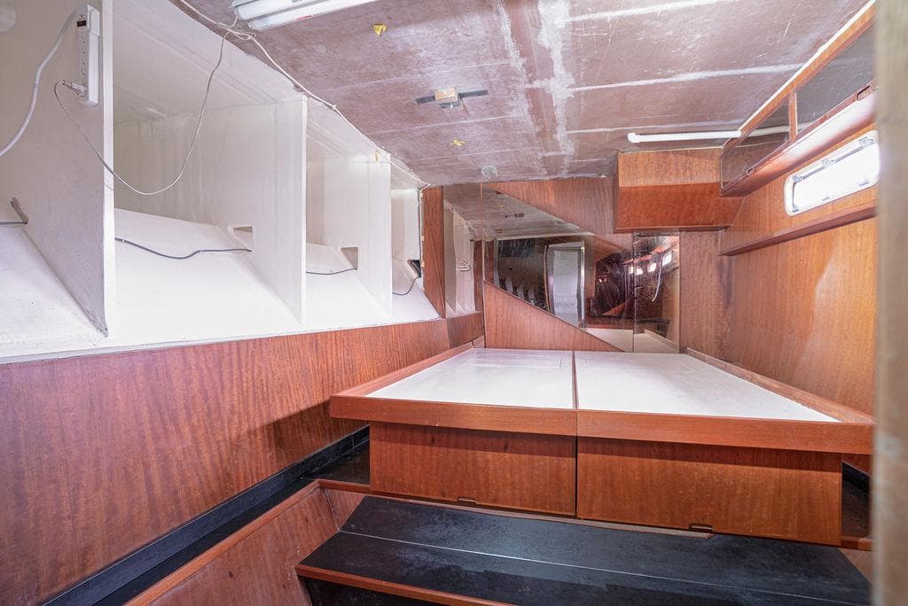 Interior of 2025 Catamaran Bloomfield 86 Motorsailor with wooden finishes and storage spaces.