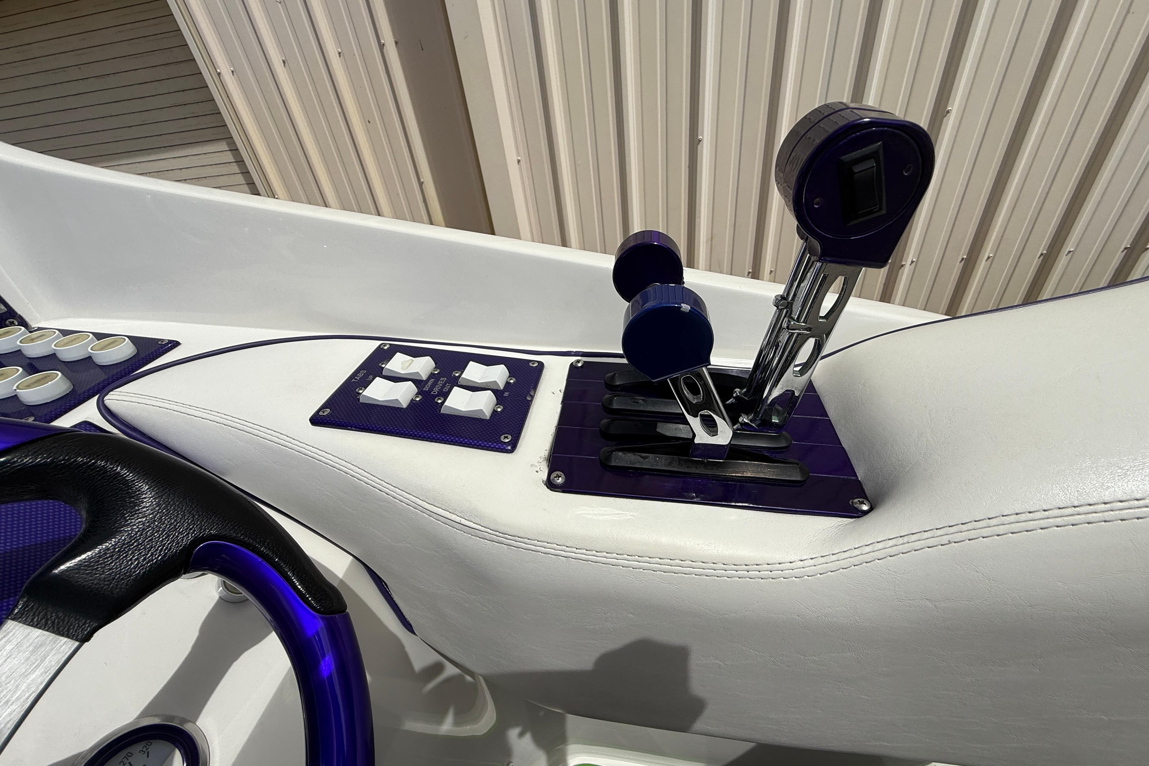 1997 Powerplay Powerboats 33 Sport Deck throttle controls and dashboard detail.